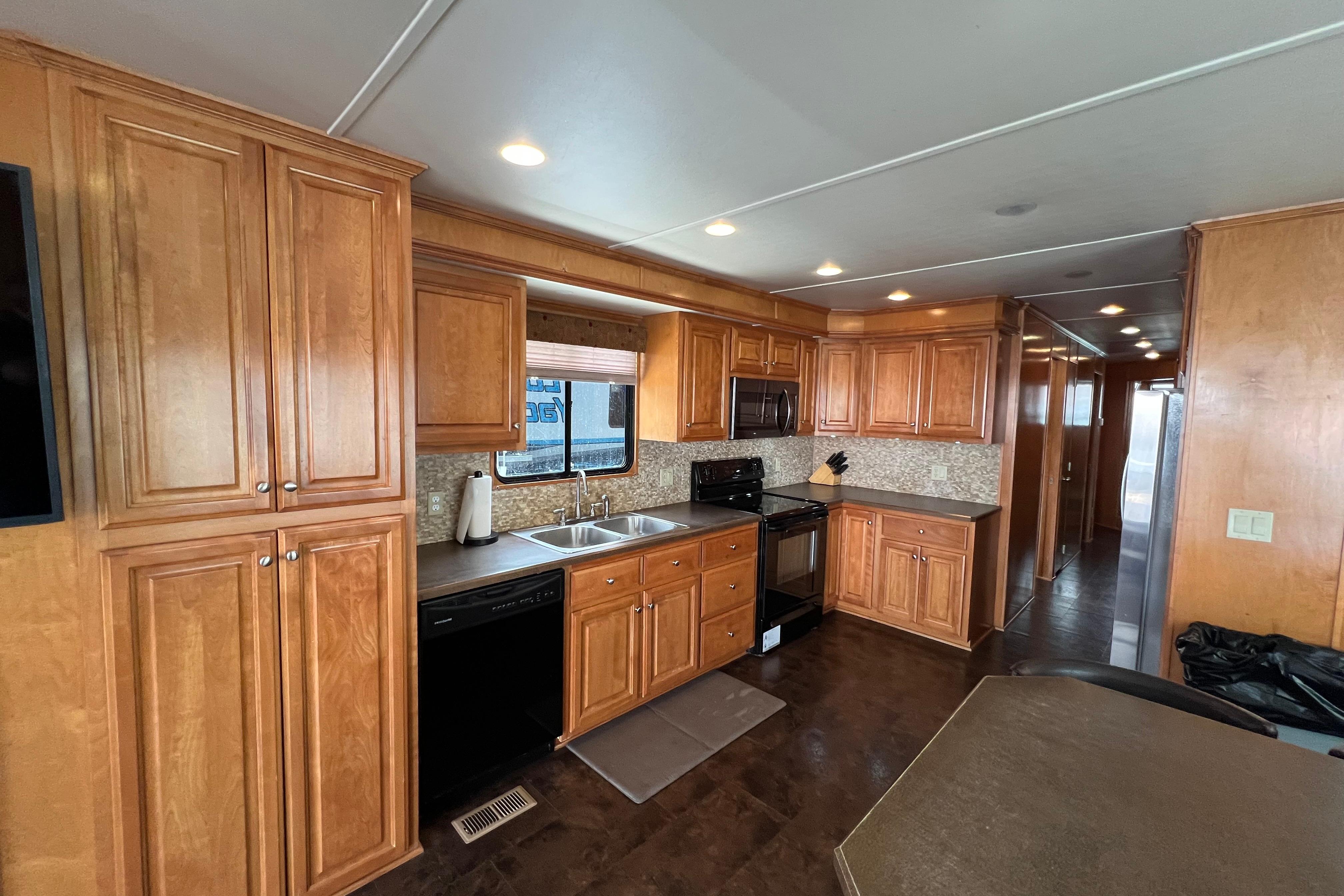 Luxurious kitchen interior of 2013 Destination Yacht Lotta Yachta with wooden cabinetry.