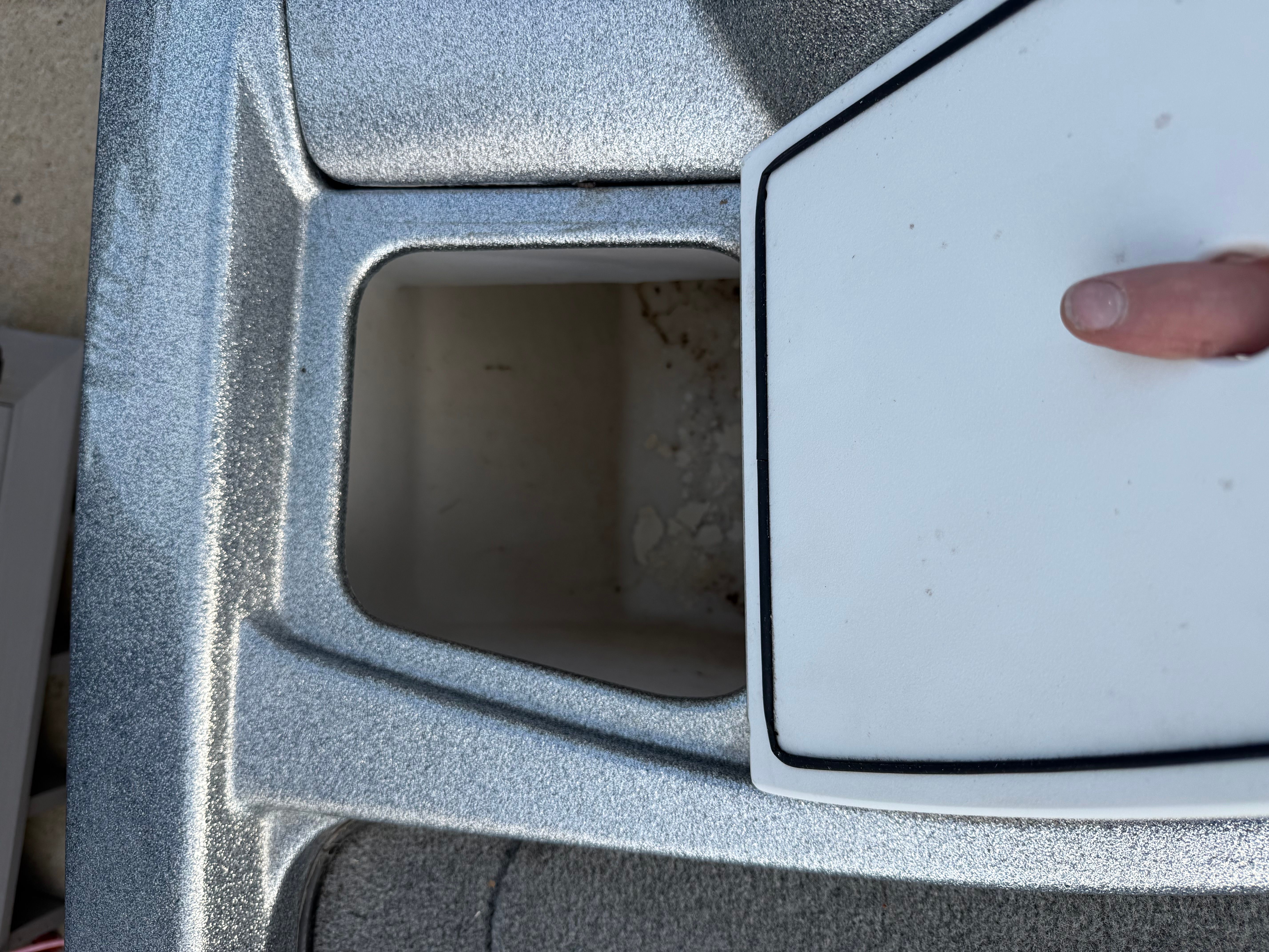 Open storage compartment of a 2004 Nitro NX 898 DC boat.