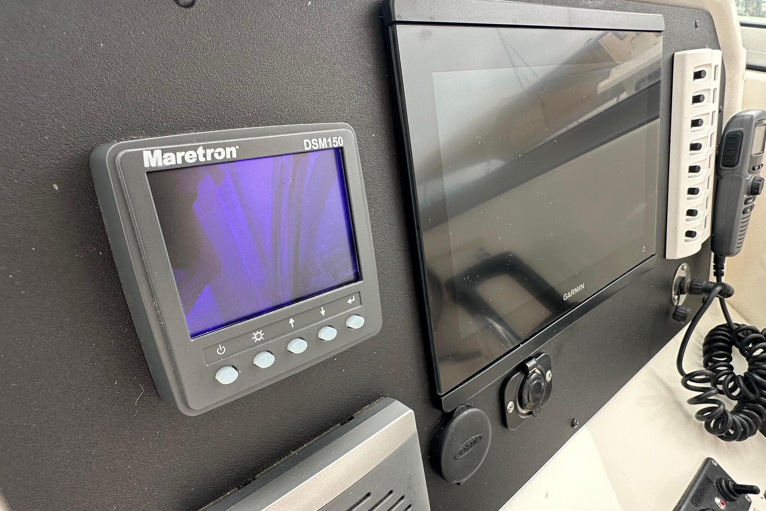 Control panel of a 2013 Glacier Bay 2680 Coastal Runner with Maretron and Garmin displays.