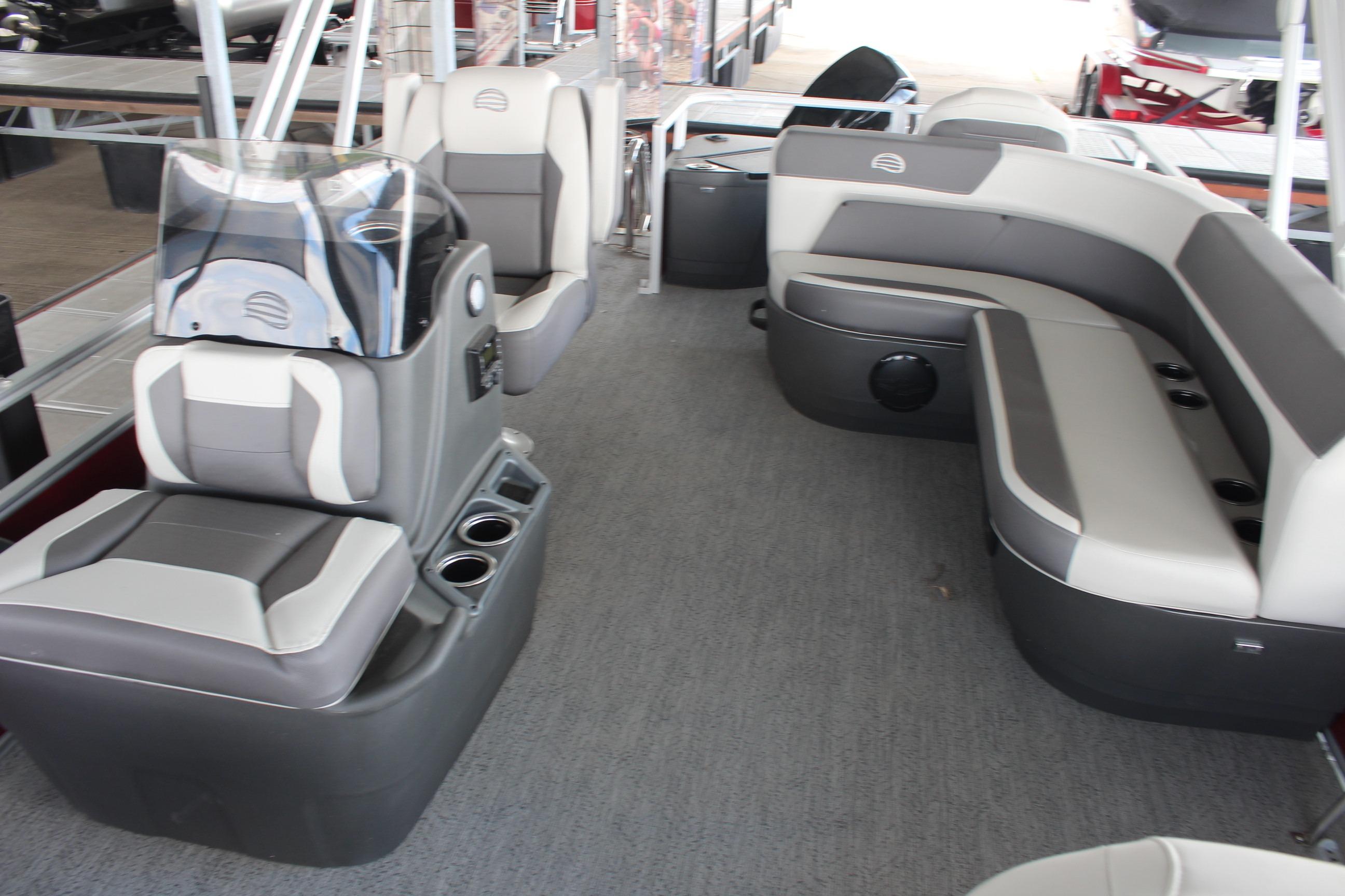 2026 Sun Tracker Bass Buggy 18 DLX interior with gray seating and helm.