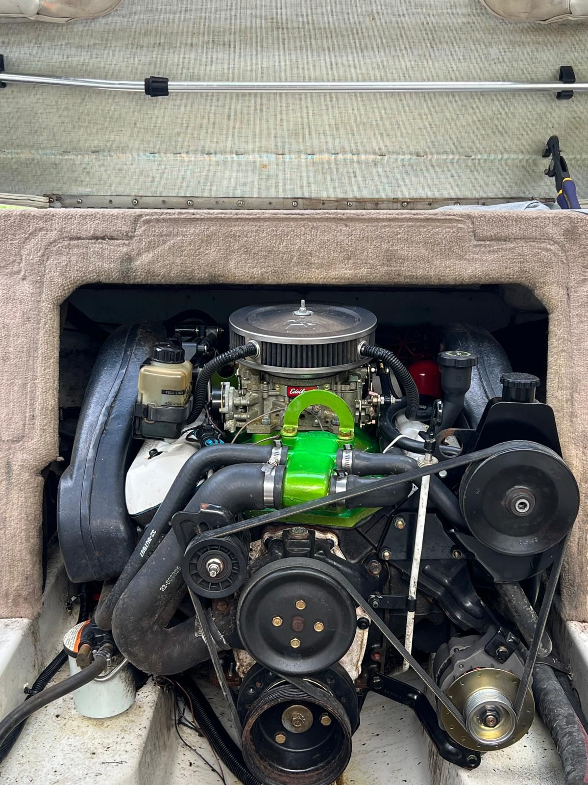 Engine compartment of a 1997 Sea Ray 190 Bow Rider with visible engine.