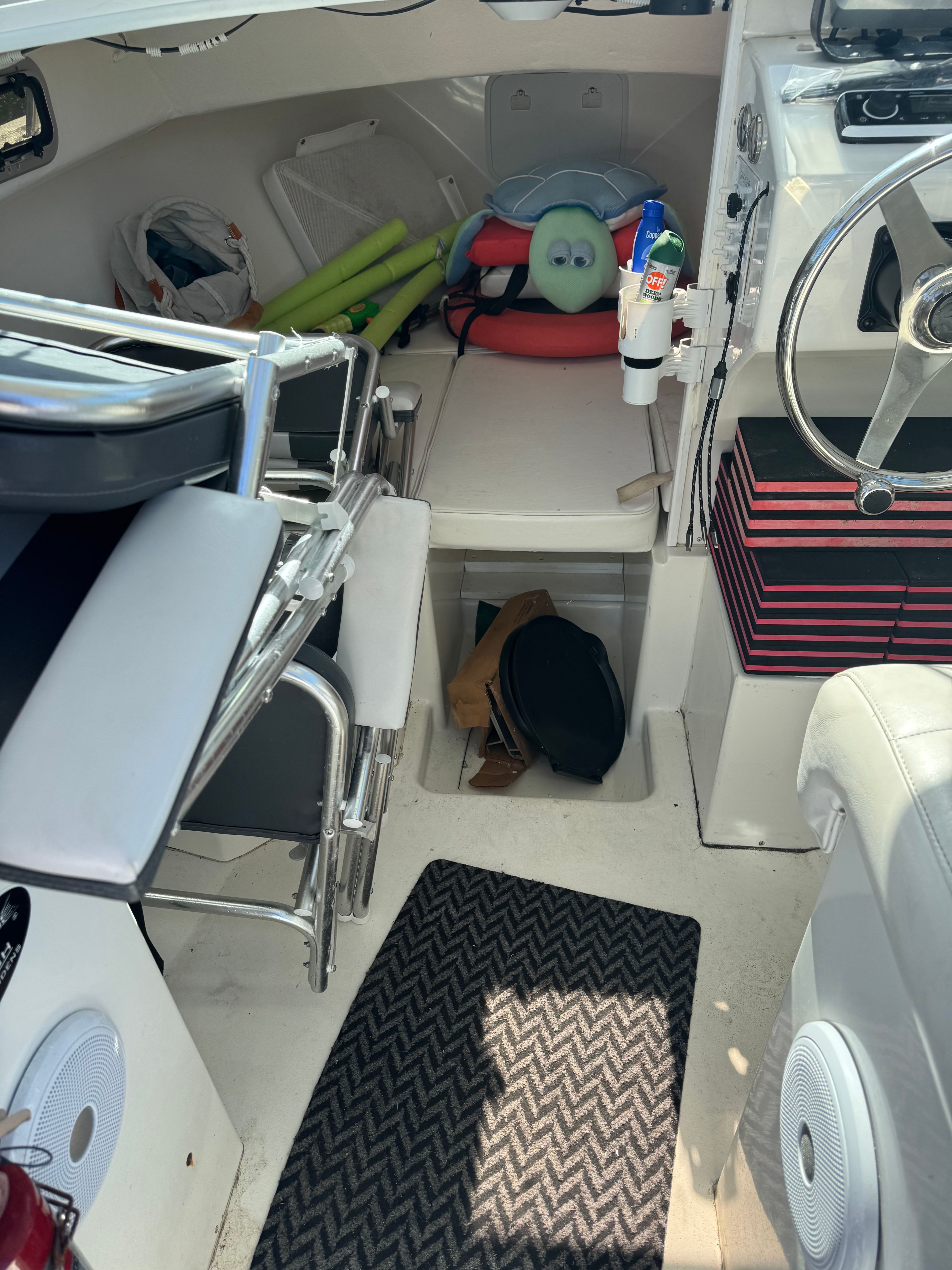 Interior of a 2009 Steiger Craft 25 Miami boat with seating and accessories.
