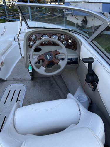 2005 Crownline 180 BR boat interior with steering wheel and dashboard controls.