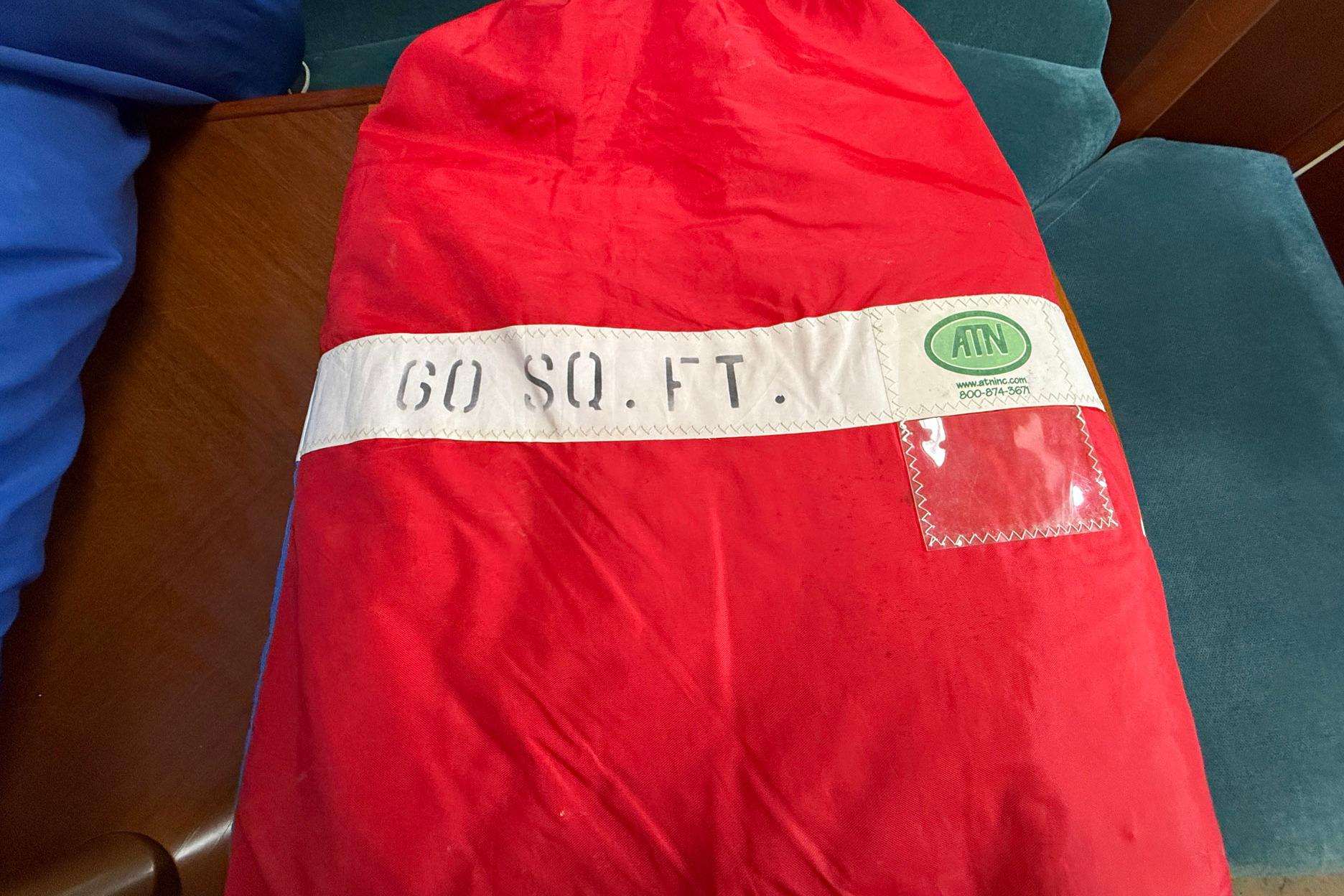 Red sail bag labeled "60 SQ. FT." for Beneteau Oceanis 352, 1998 model.