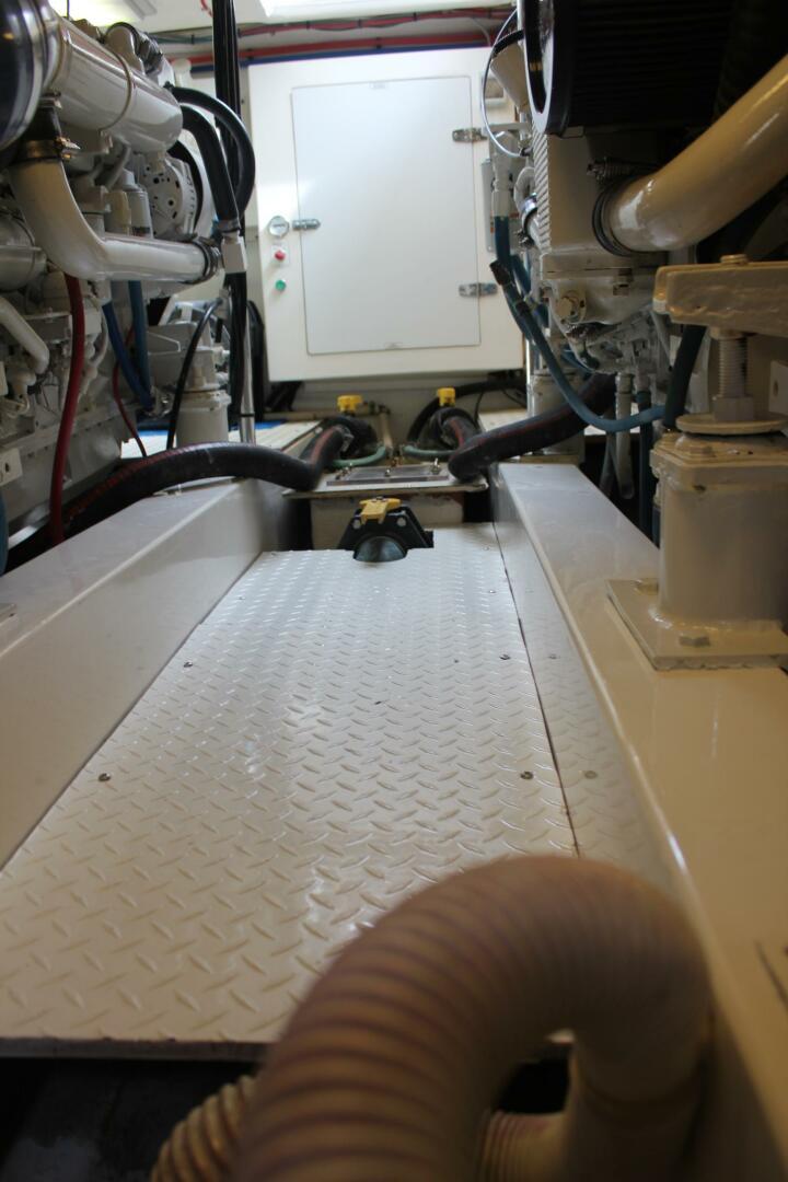 Engine room of 2000 Stolper 3800 Tournament Express with visible machinery and piping.