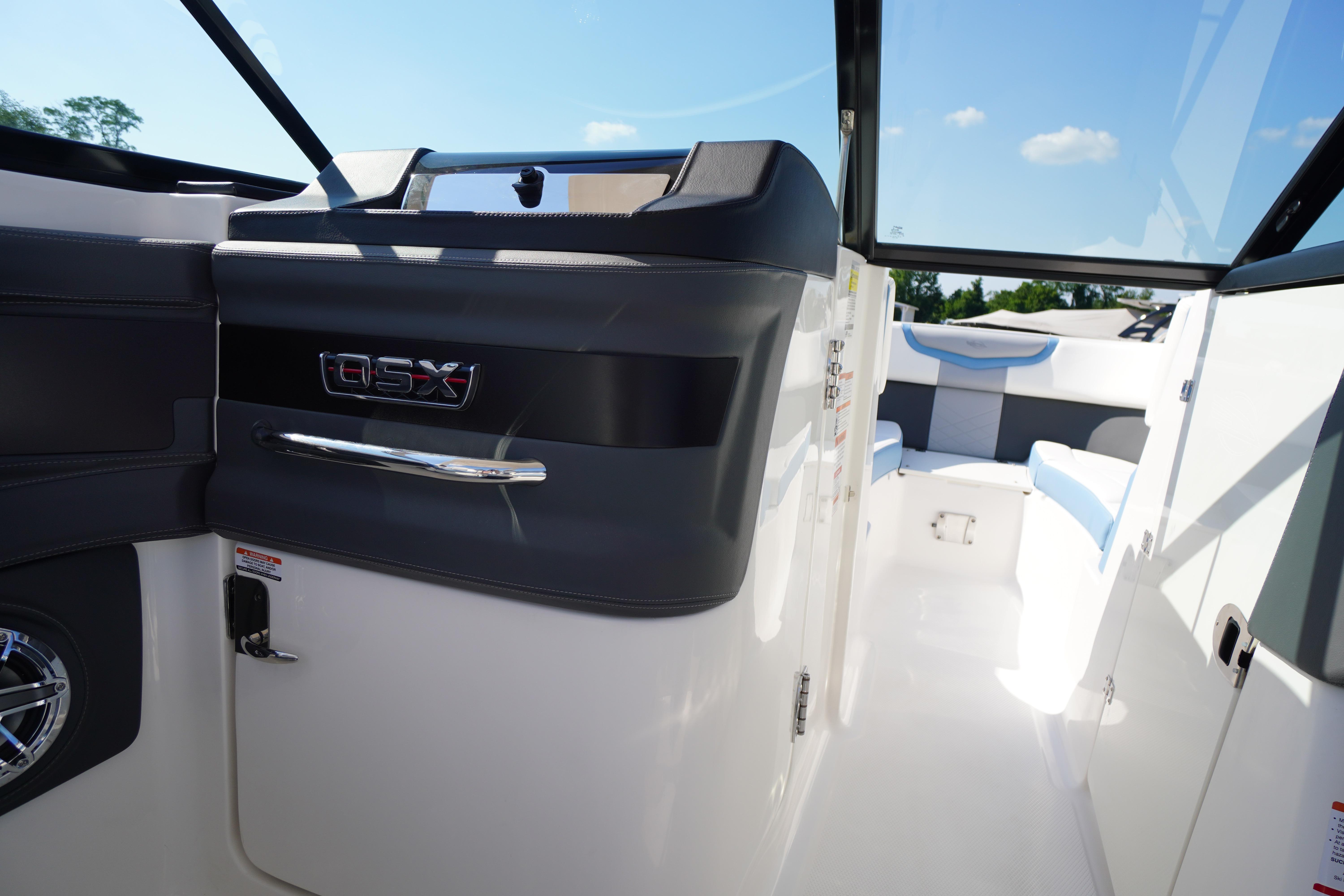 Interior view of 2026 Chaparral 270 OSX boat, featuring sleek design and modern seating.