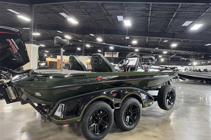 2025 Ranger Z519R Cup-Equipped boat displayed in showroom with sleek design and dual-axle trailer.