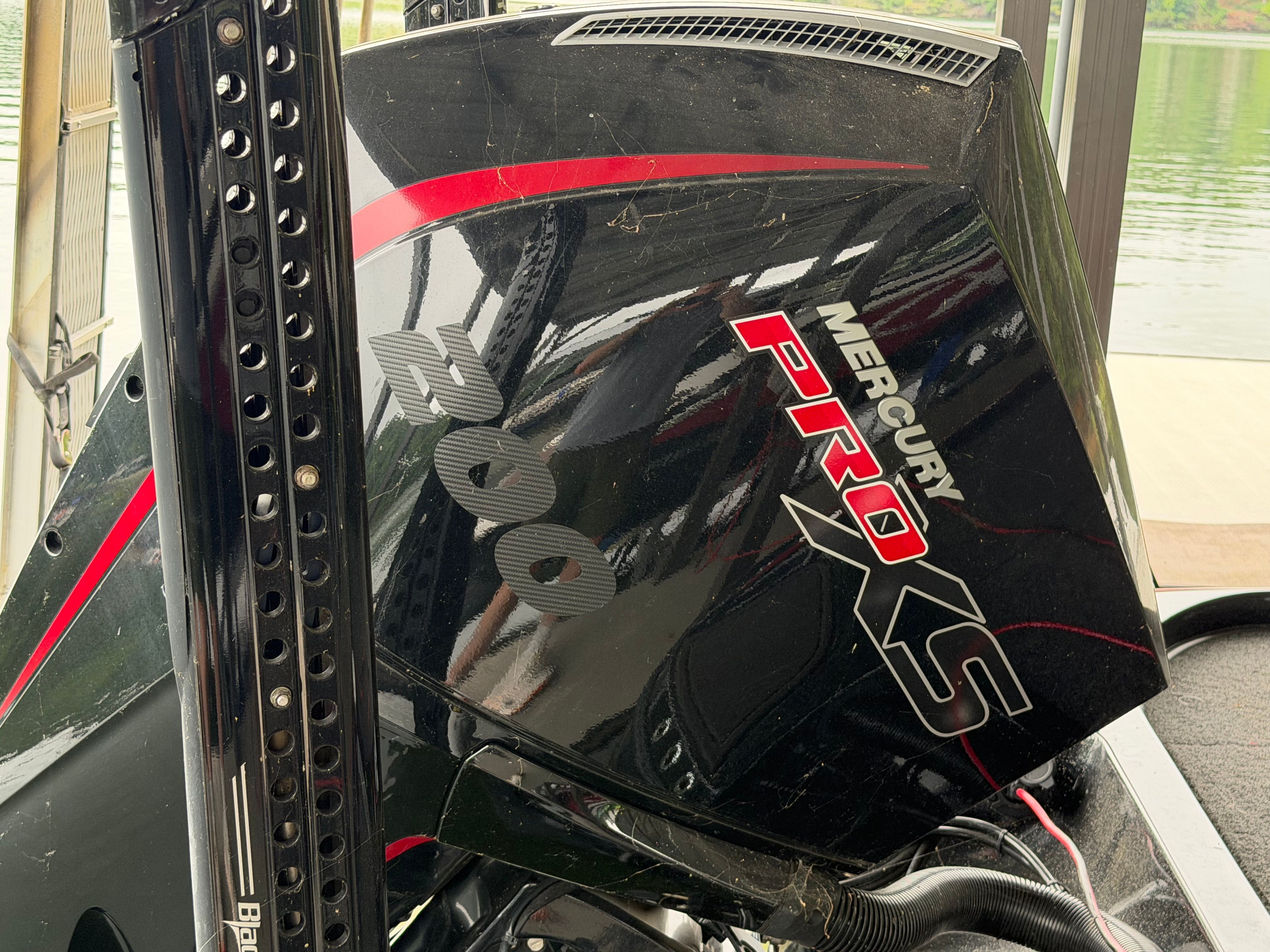 Close-up of a Mercury Pro XS outboard motor on a boat.