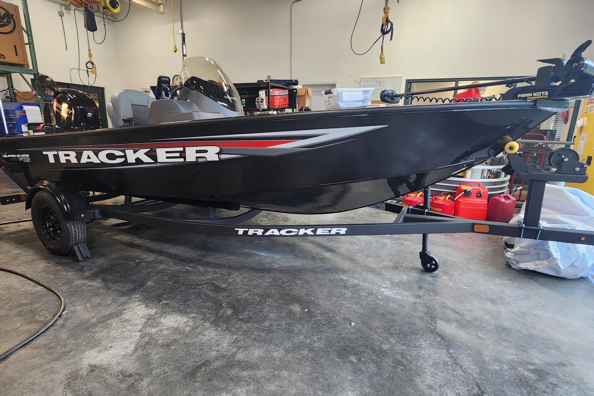 2026 Tracker Super Guide V-16 SC boat on trailer in garage setting.