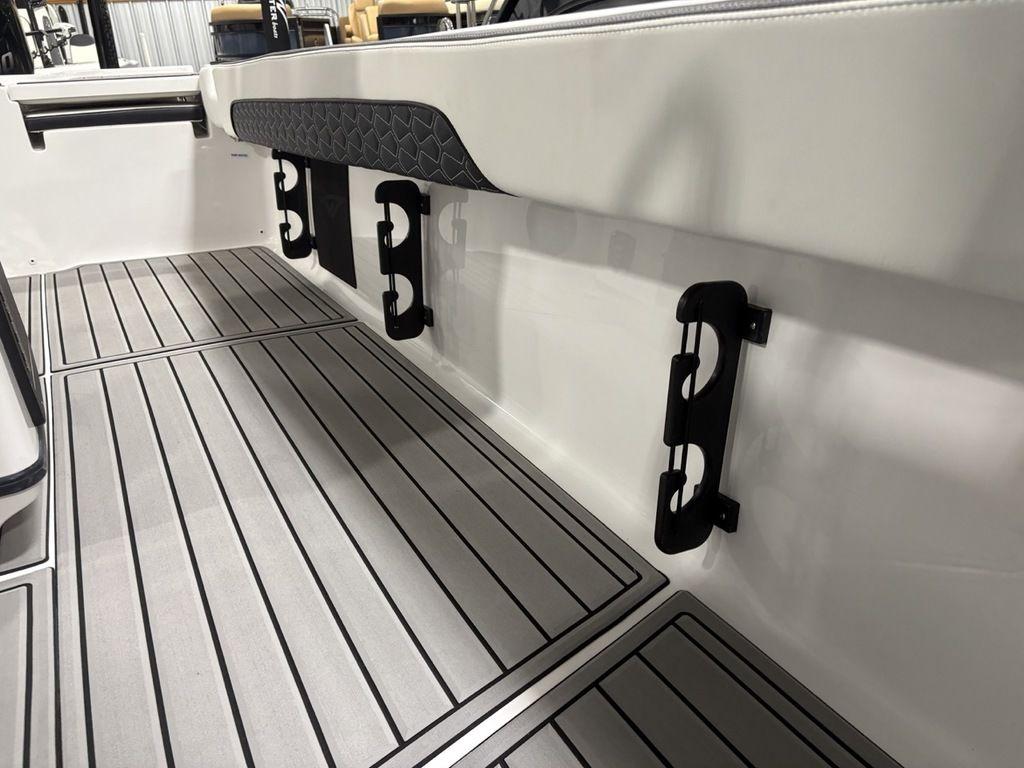 2026 Tidewater 2700 CB boat interior with sleek flooring and rod holders.