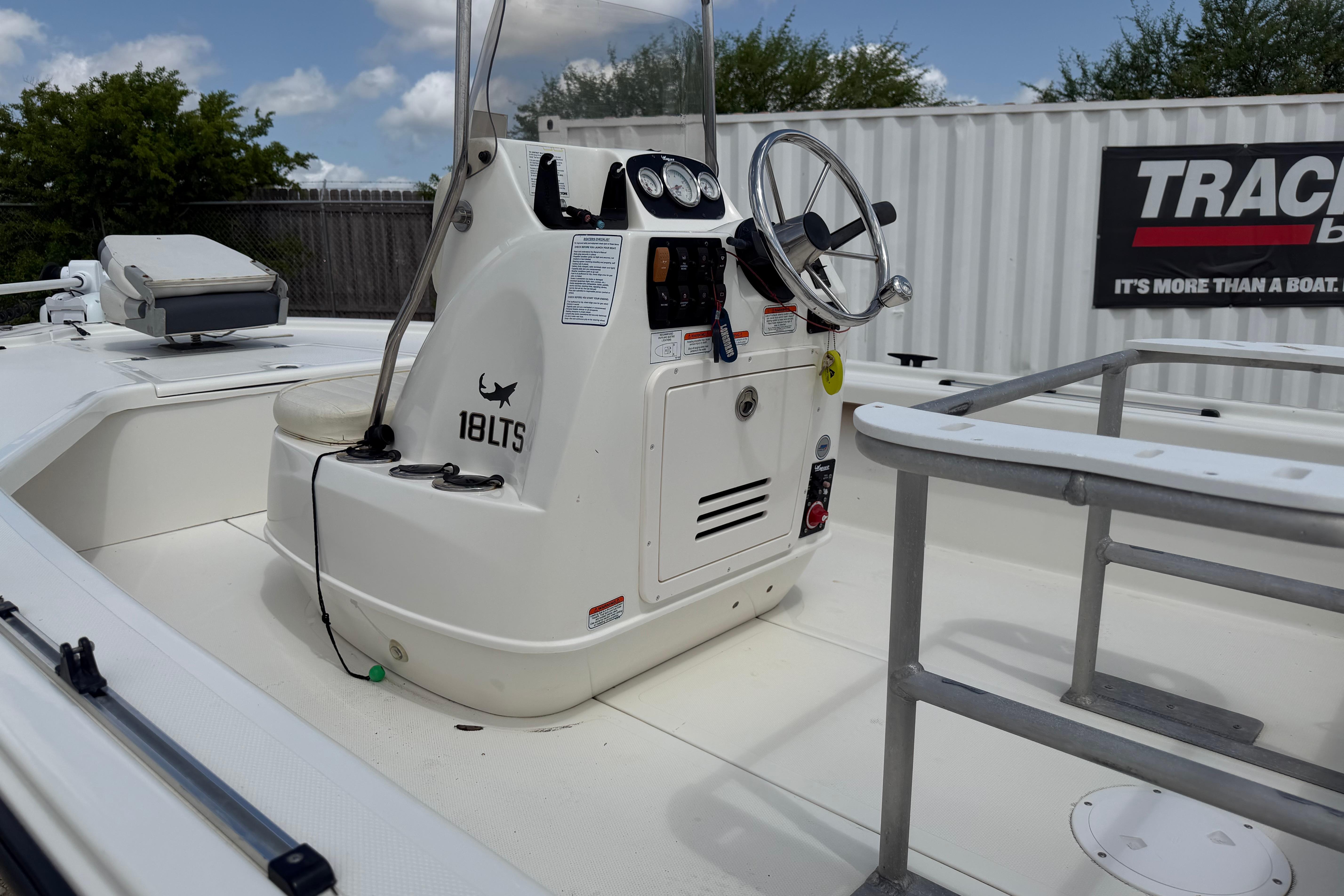 2012 Mako 18 LTS boat interior with steering console and seating.
