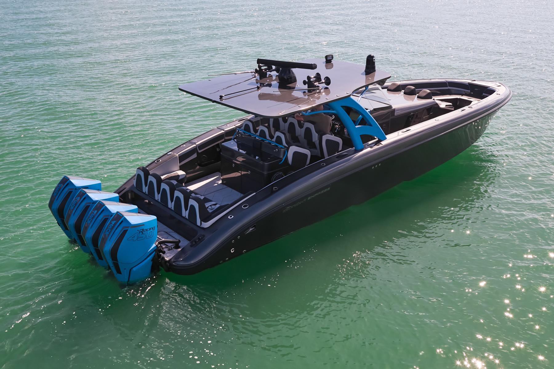 2023 Midnight Express 43' Solstice boat with multiple engines on calm water.