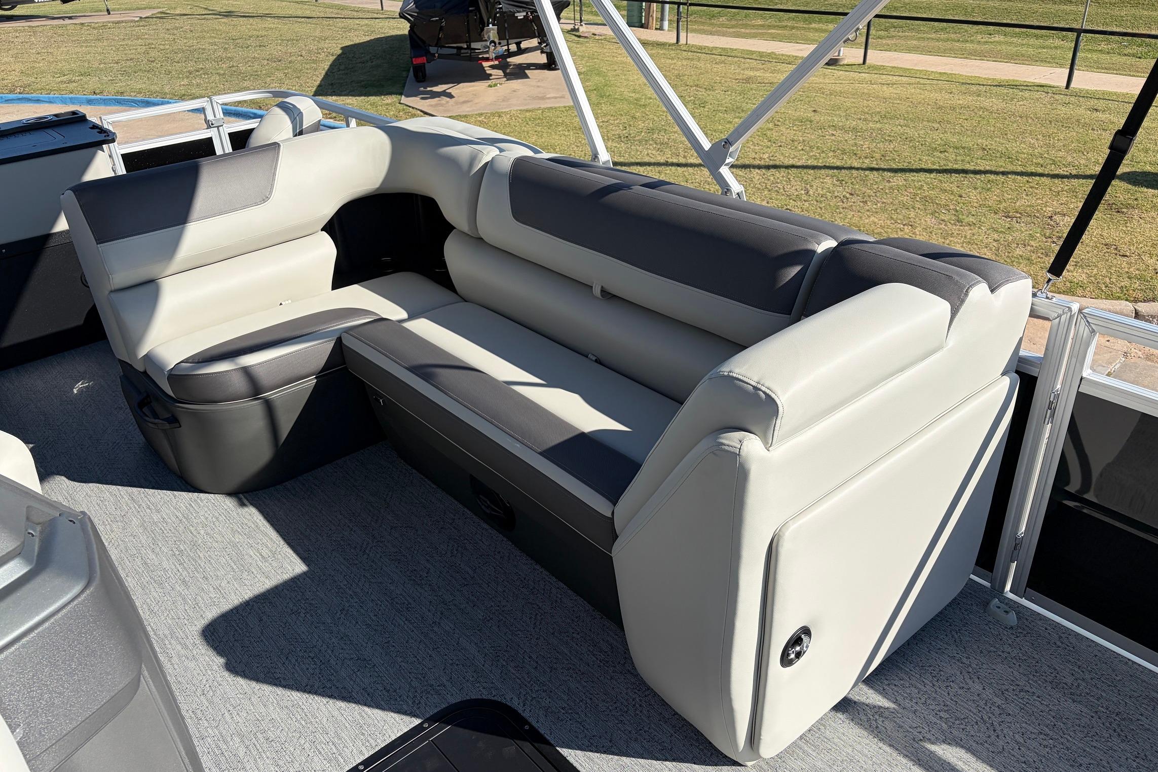 2026 Sun Tracker Fishin' Barge 22 XP3 interior seating, featuring plush gray upholstery.