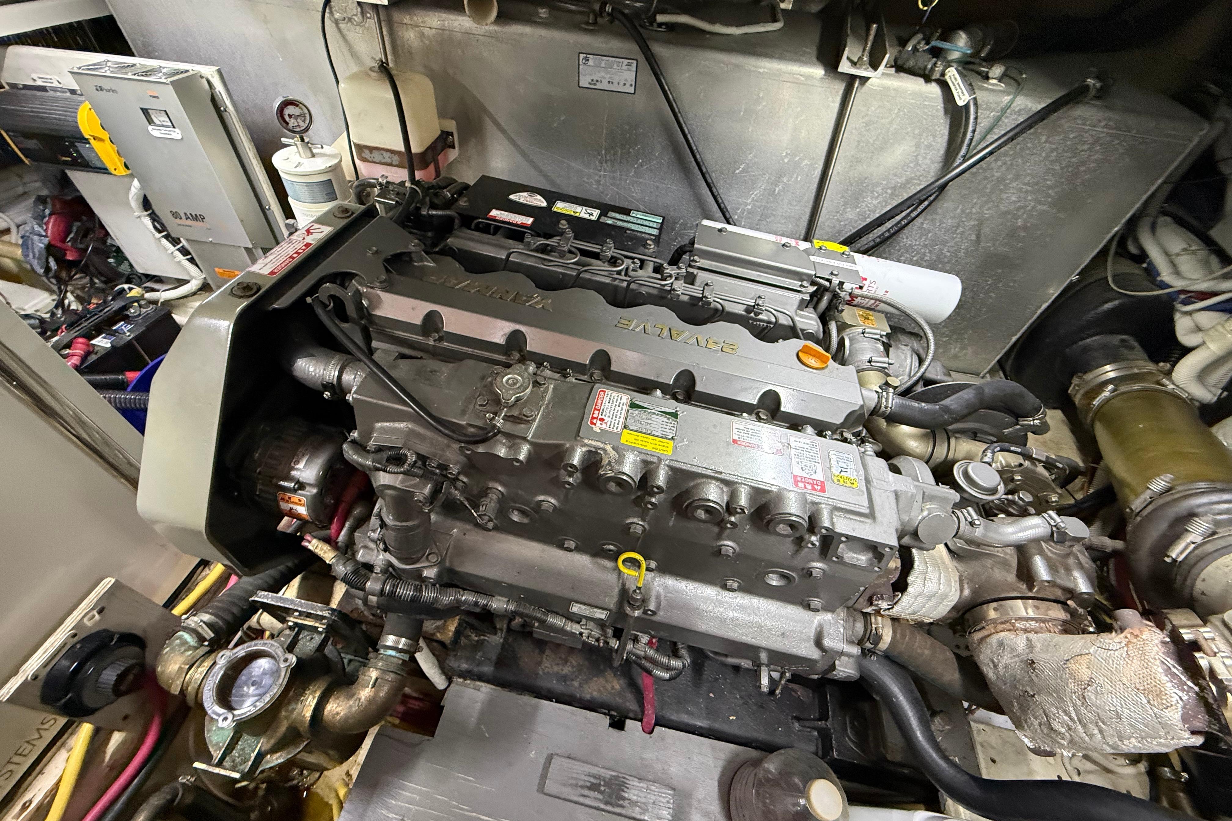 Engine room of a 2006 Carver 43 Motor Yacht, showcasing detailed machinery and components.