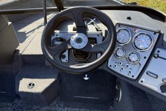 2026 Tracker Pro Guide V-175 Combo boat dashboard with steering wheel and gauges.
