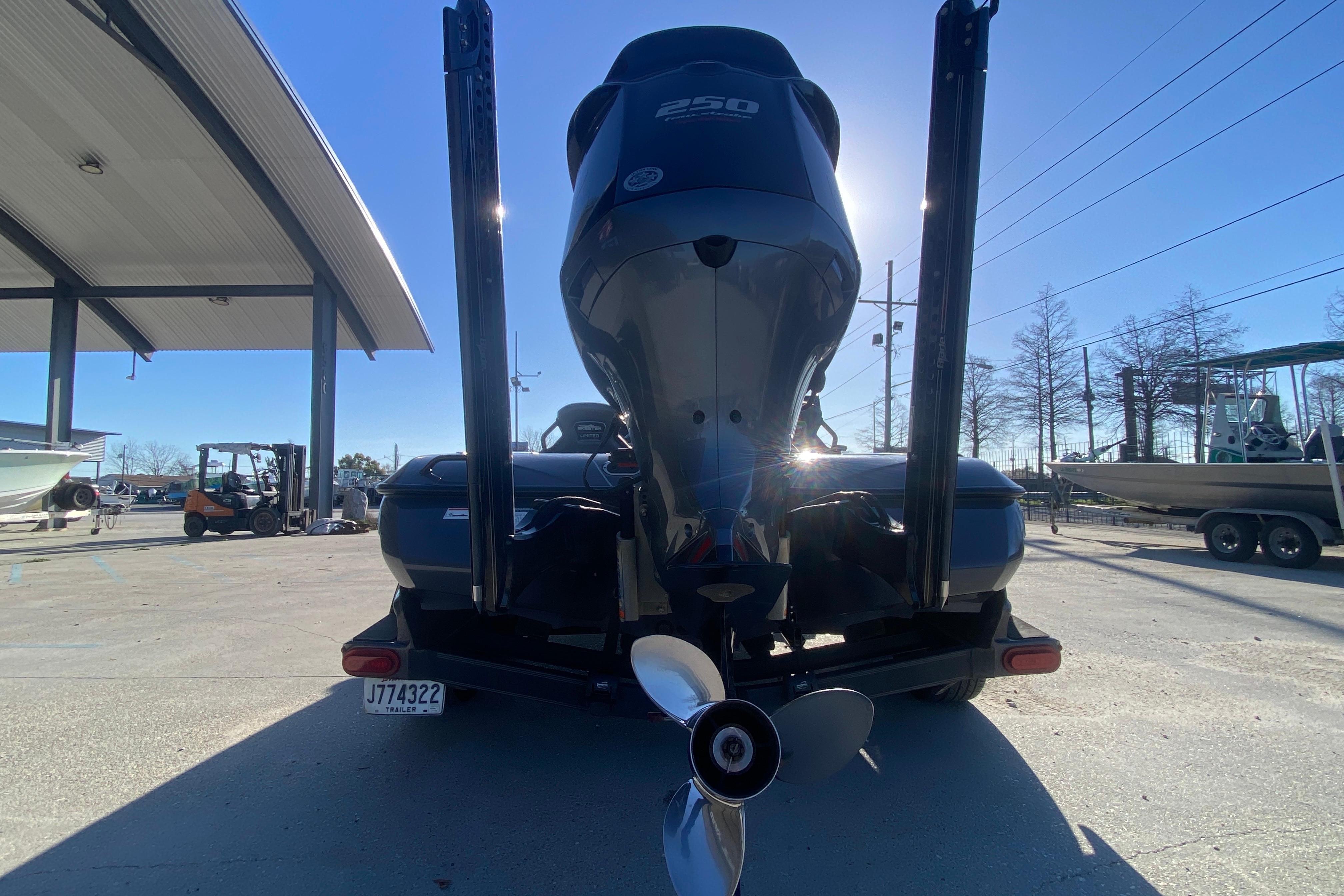 2020 Skeeter FXR20 Limited boat with powerful outboard motor in a sunny marina.
