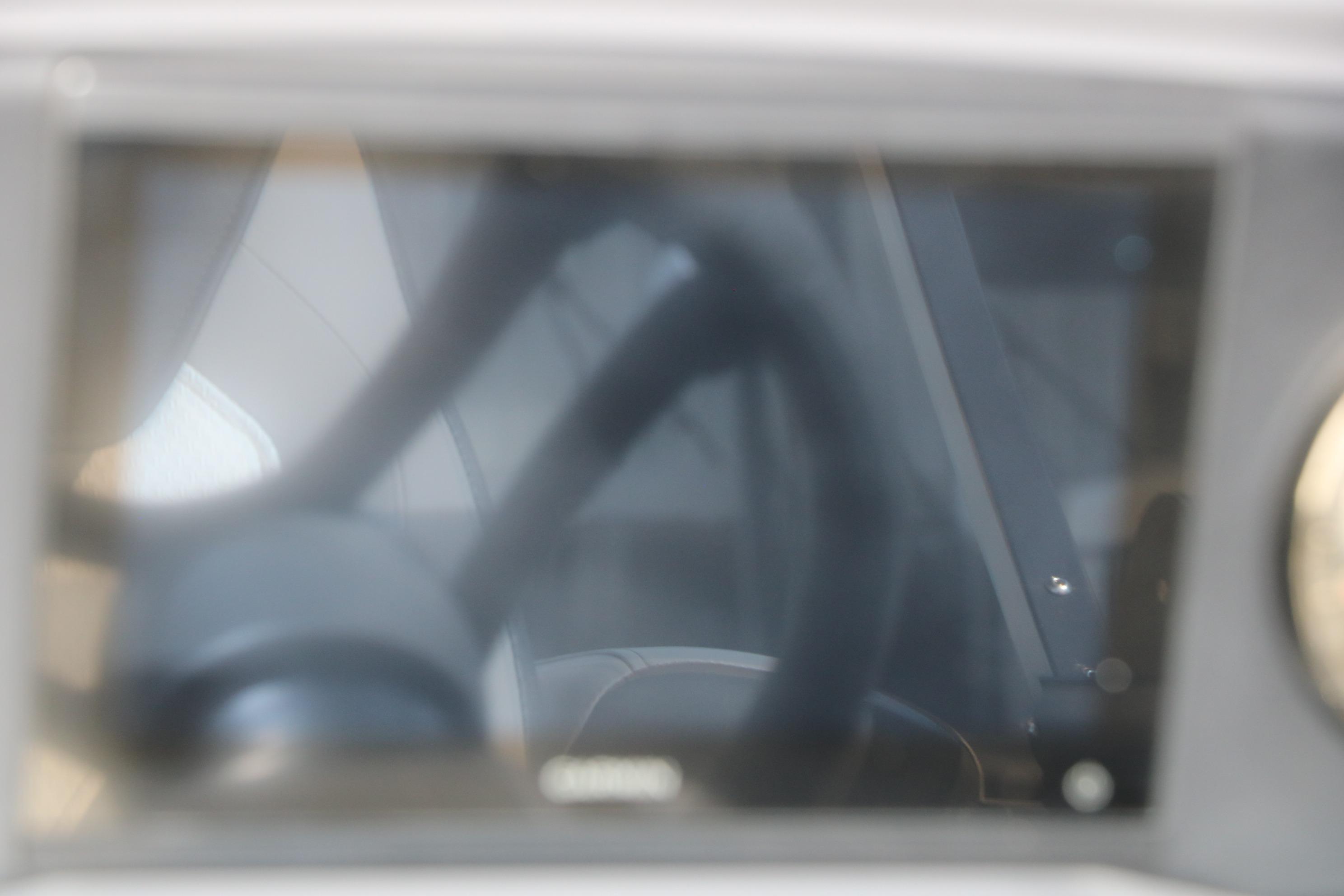 Blurry interior view of 2026 Evotti 521QL vehicle dashboard and steering wheel.