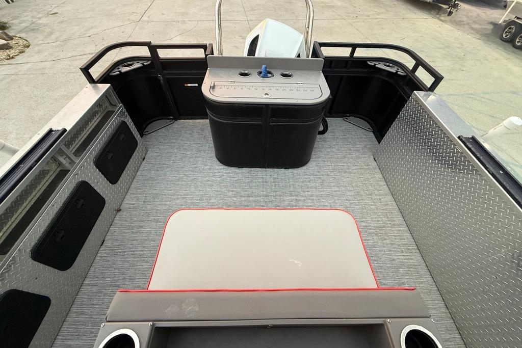 2022 Apex Marine 8524 Pro Fish N Cruise boat interior with fishing station and seating.