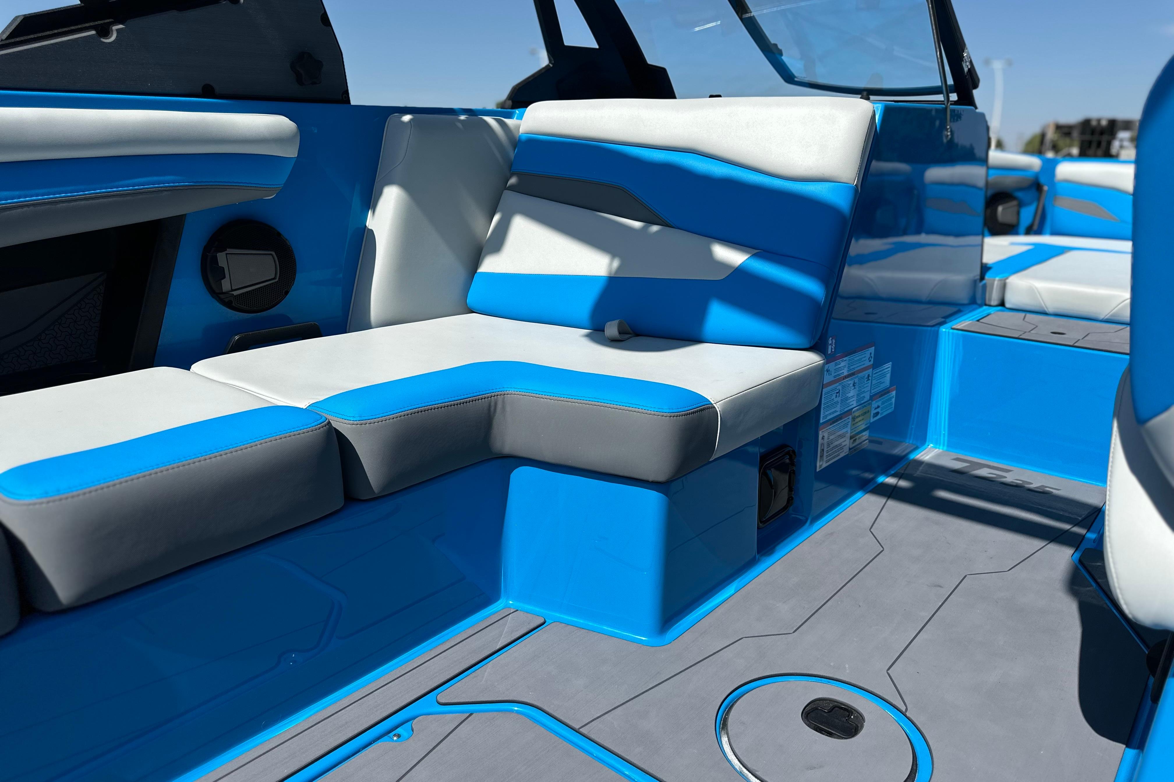 2026 Axis T235 boat interior with blue and gray seating, modern design.