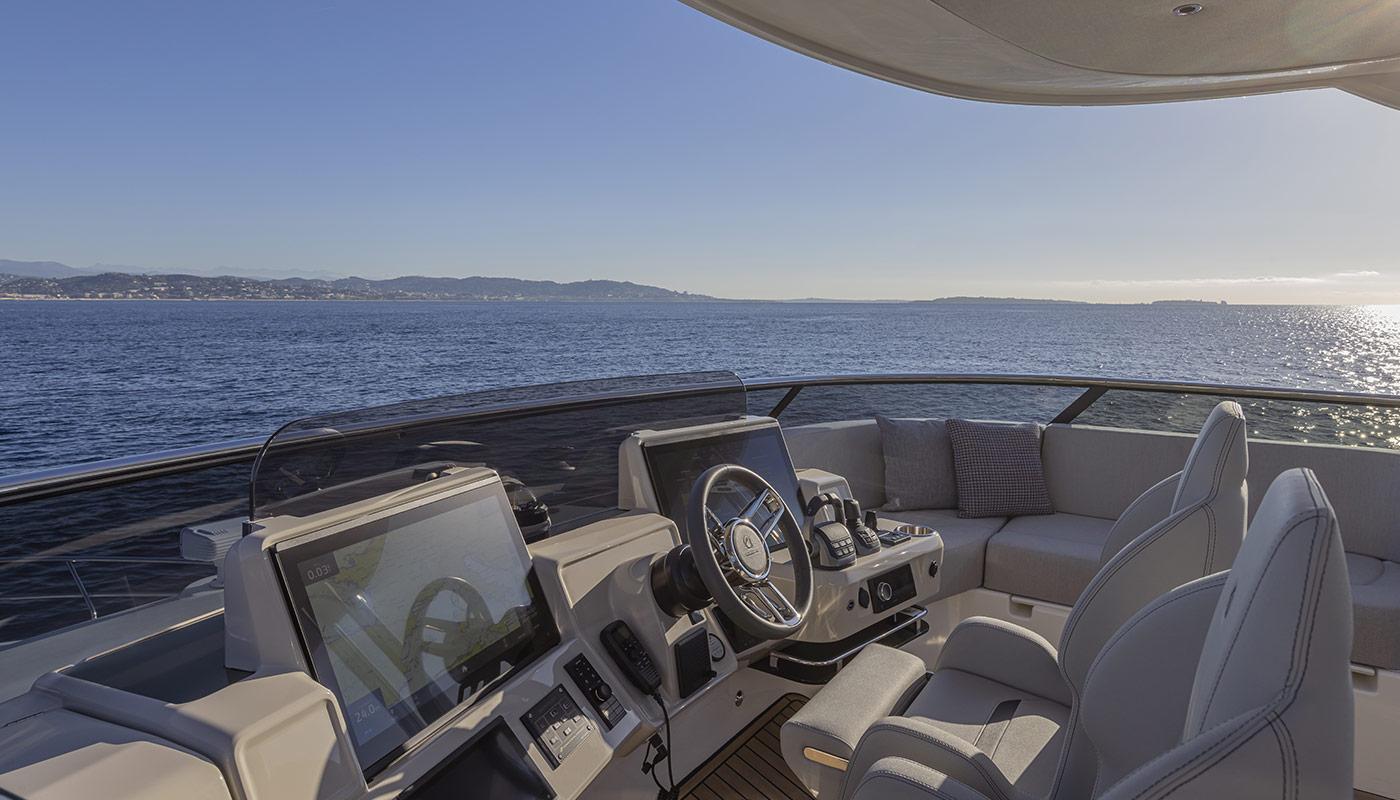 Luxurious Absolute NAVETTA 75 yacht helm, 2026 model, overlooking serene ocean view.