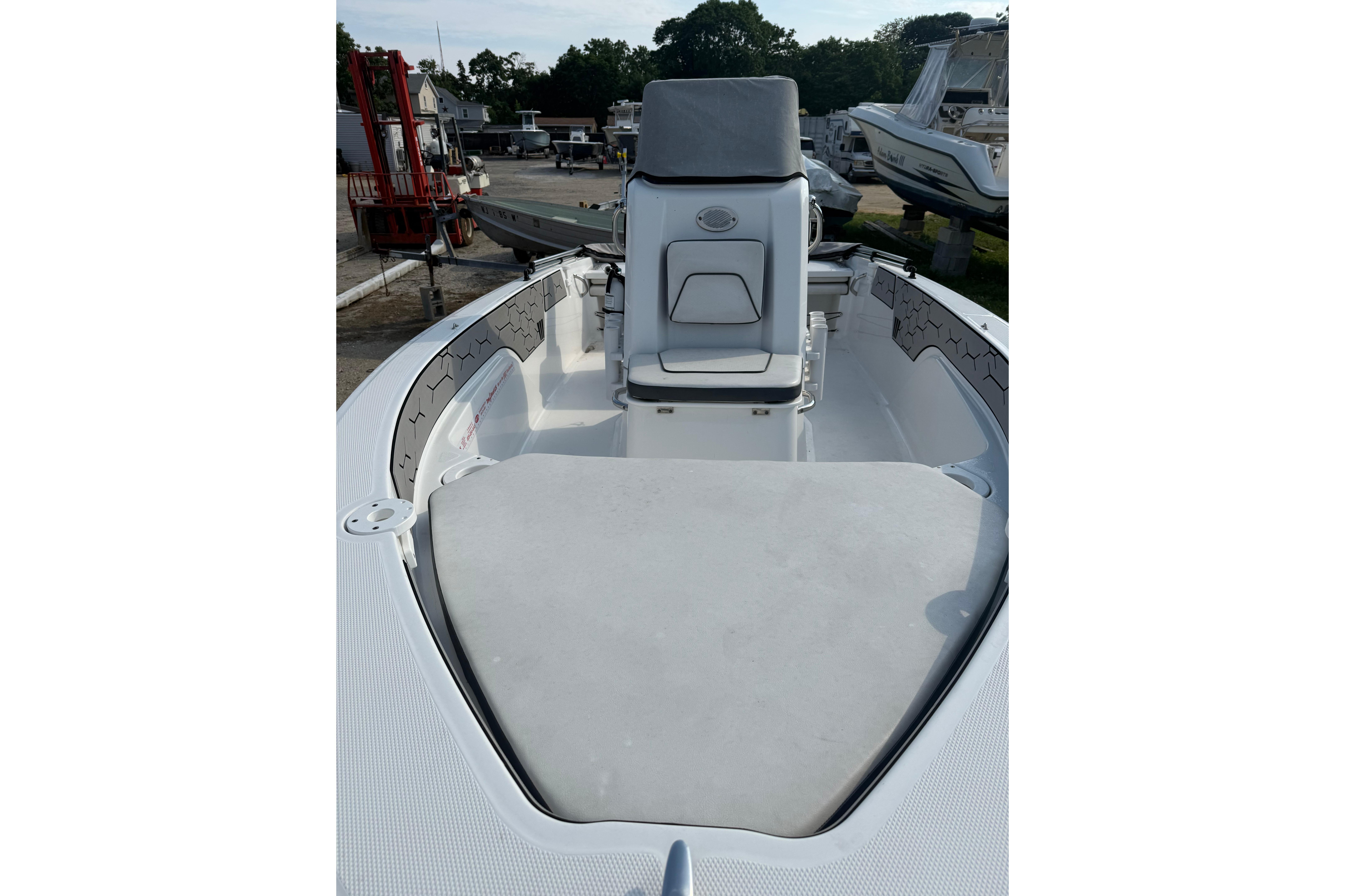 2020 Wellcraft 162 Fisherman boat interior with seating and storage, docked outdoors.