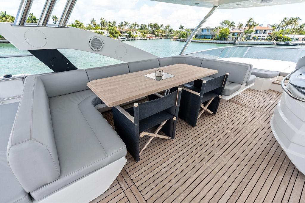 Luxurious Sunseeker 75 Sport Yacht 2018 deck with elegant seating and dining area.