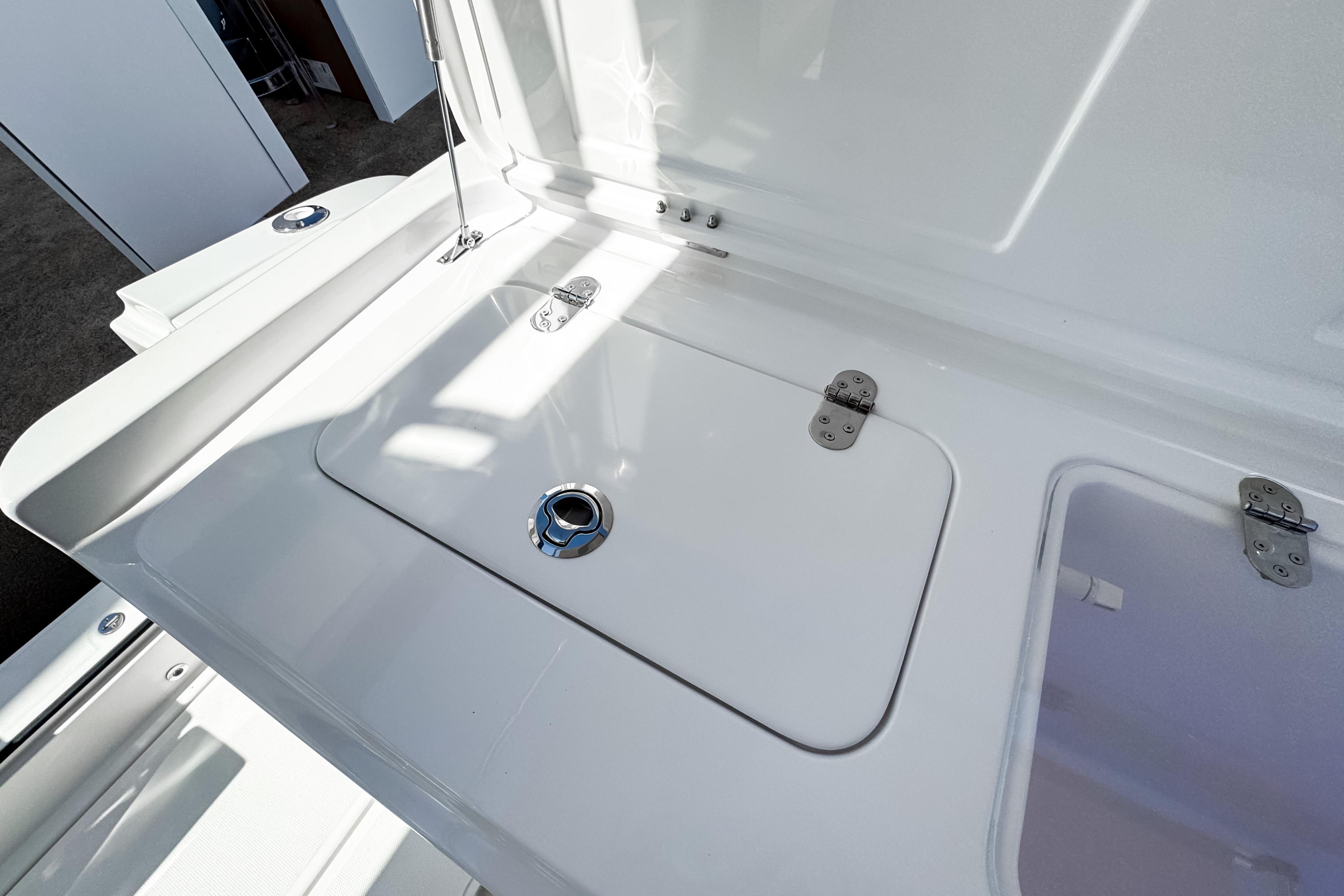 2025 Aiata Wayfinder 38 Open boat storage compartment with sleek white finish.