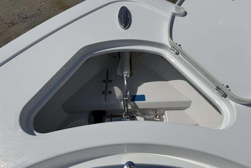 2026 Sportsman Open 252 Center Console anchor storage compartment, open lid view.