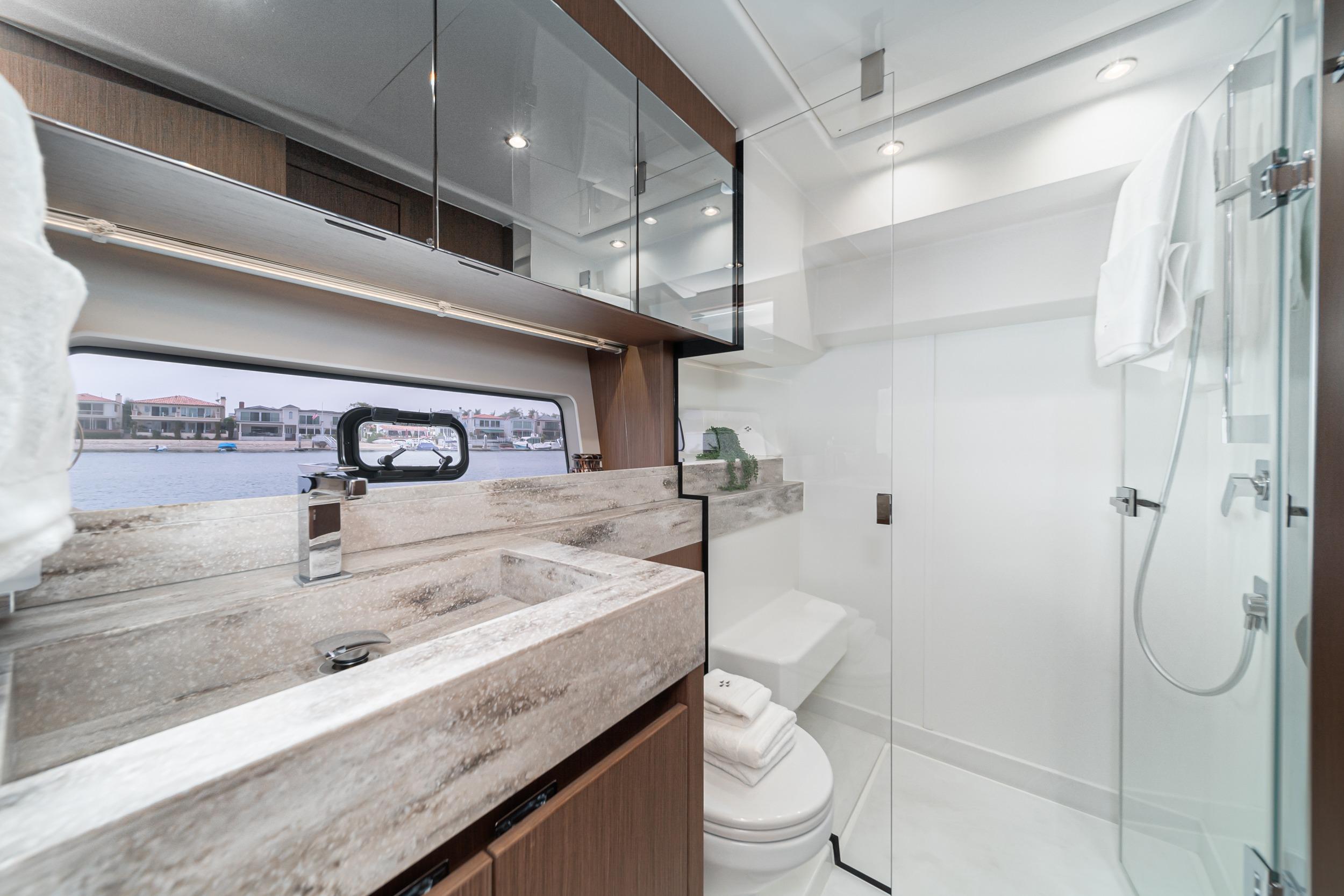 Luxurious 2024 Prestige X60 yacht bathroom with modern fixtures and elegant design.