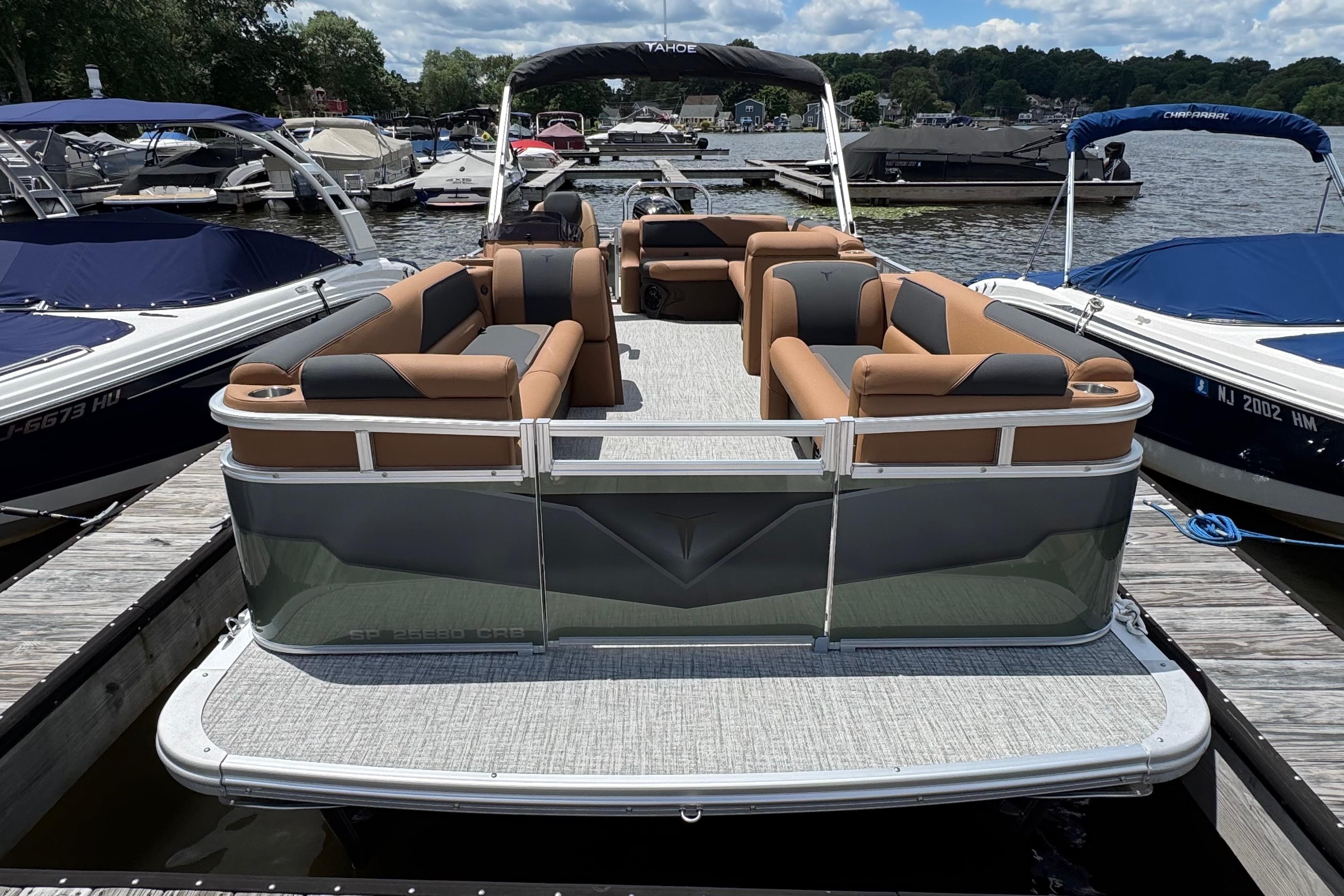 2026 Tahoe Pontoon Sport 85 Cruise Rear Bench 23 docked, featuring spacious seating and sleek design.