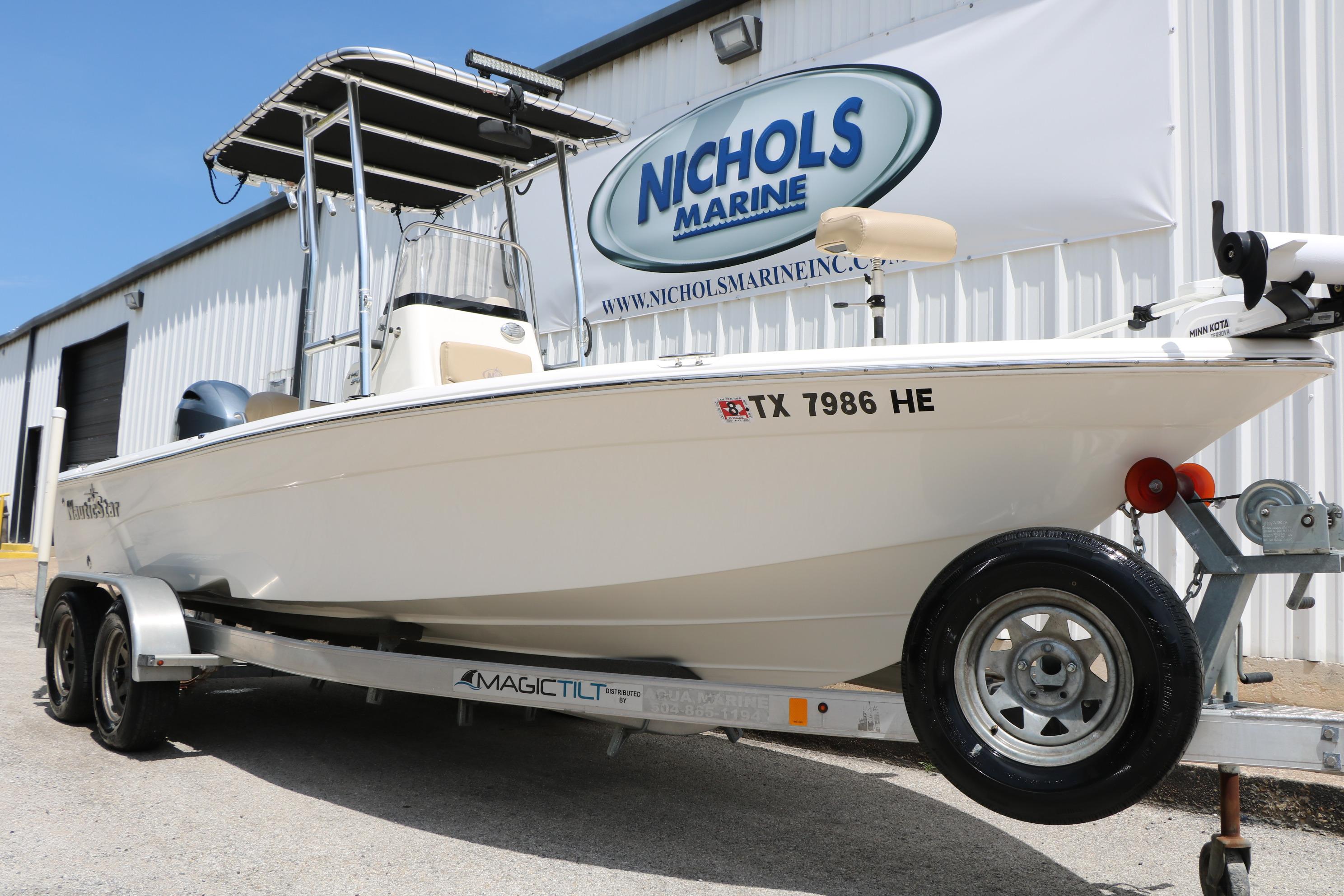 2020 NauticStar 2140 Sport boat on trailer at Nichols Marine dealership.