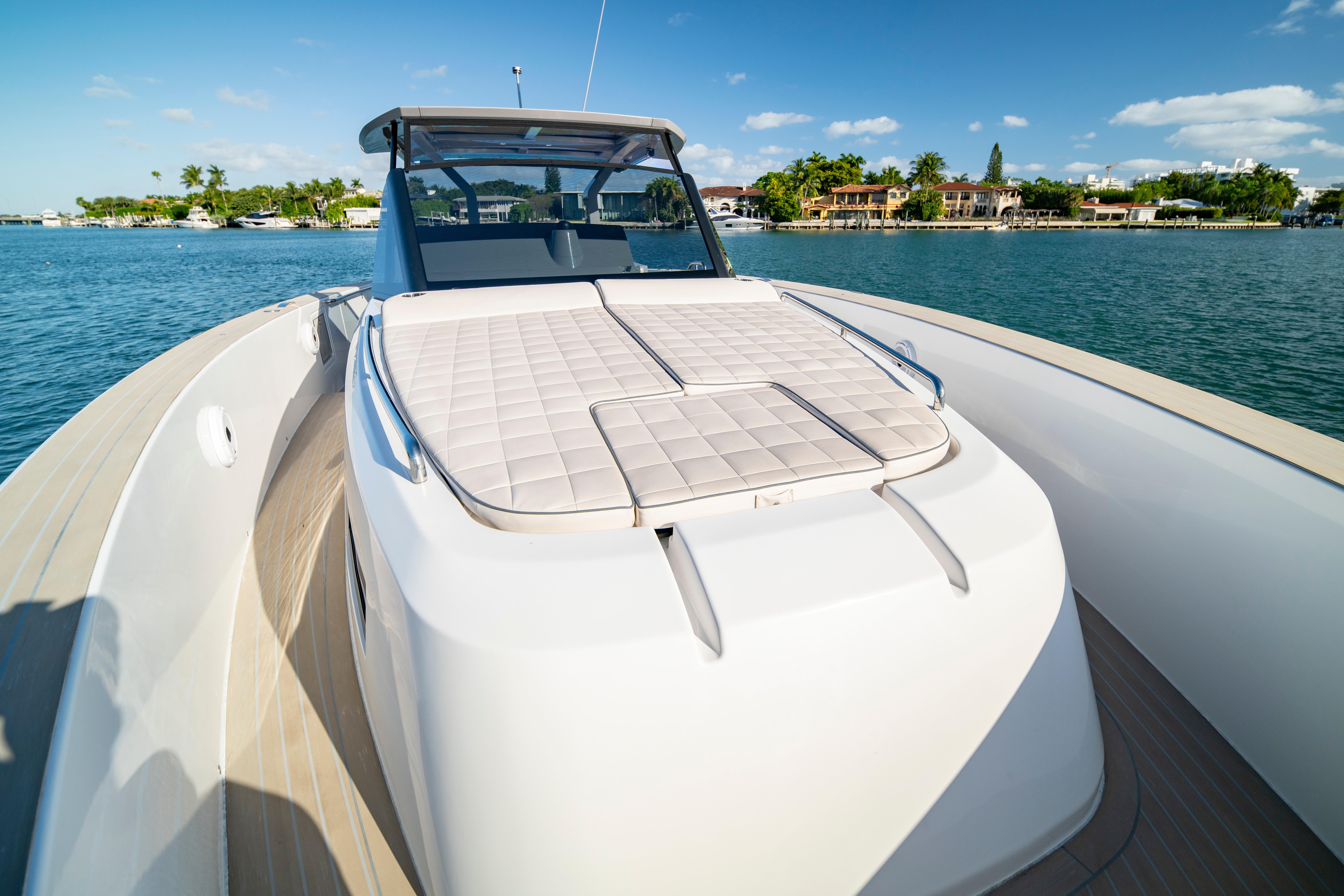 2024 Pardo Yachts P43 luxury yacht on serene water with sunbathing deck.