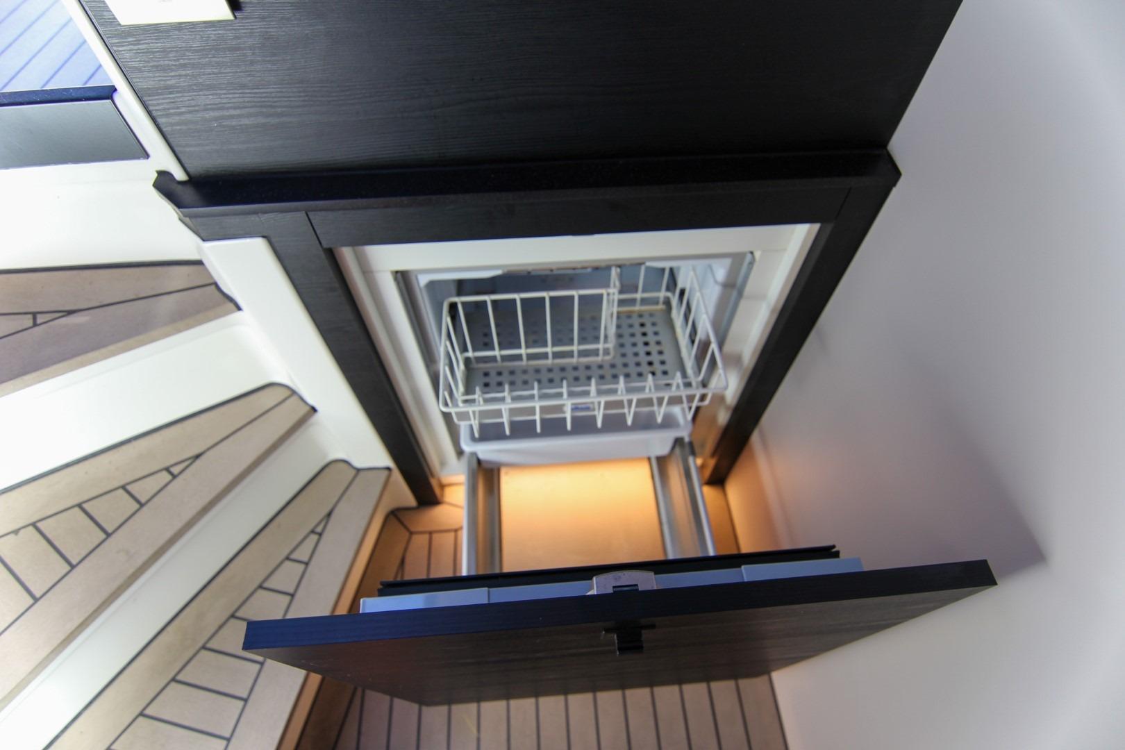 Modern interior of 2022 Vanquish Yachts VQ45 with open drawer storage.