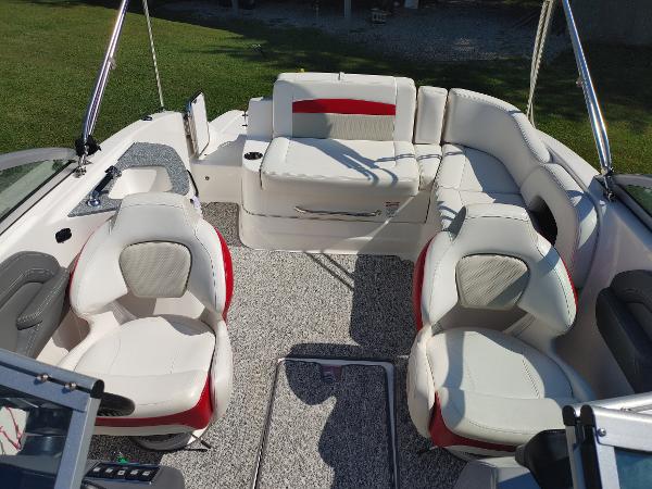 2014 Chaparral 224 Sunesta boat interior with white and red seating.