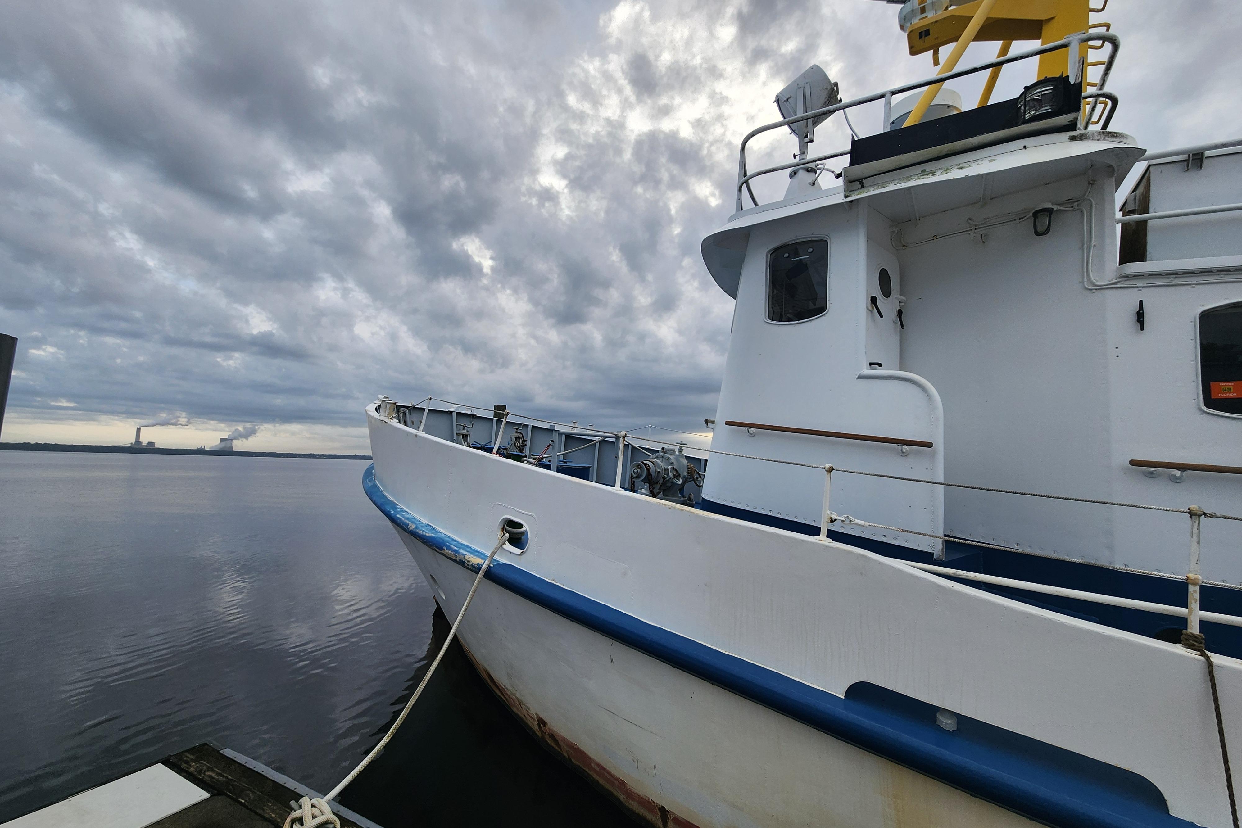 White Stord Verft 60 ship from 1960 docked under cloudy skies.