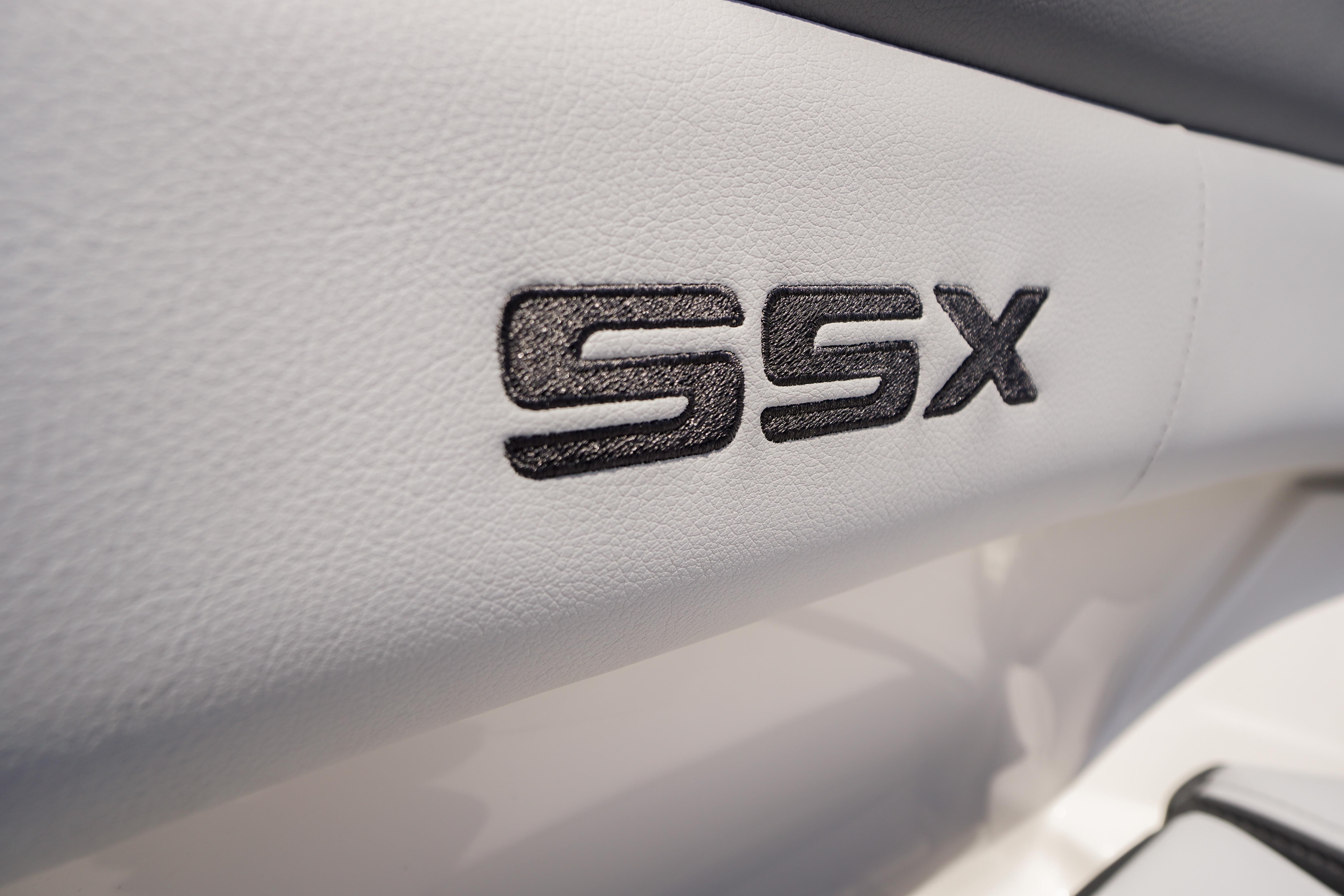 2026 Chaparral SSX 4 interior detail with embroidered logo on white upholstery.