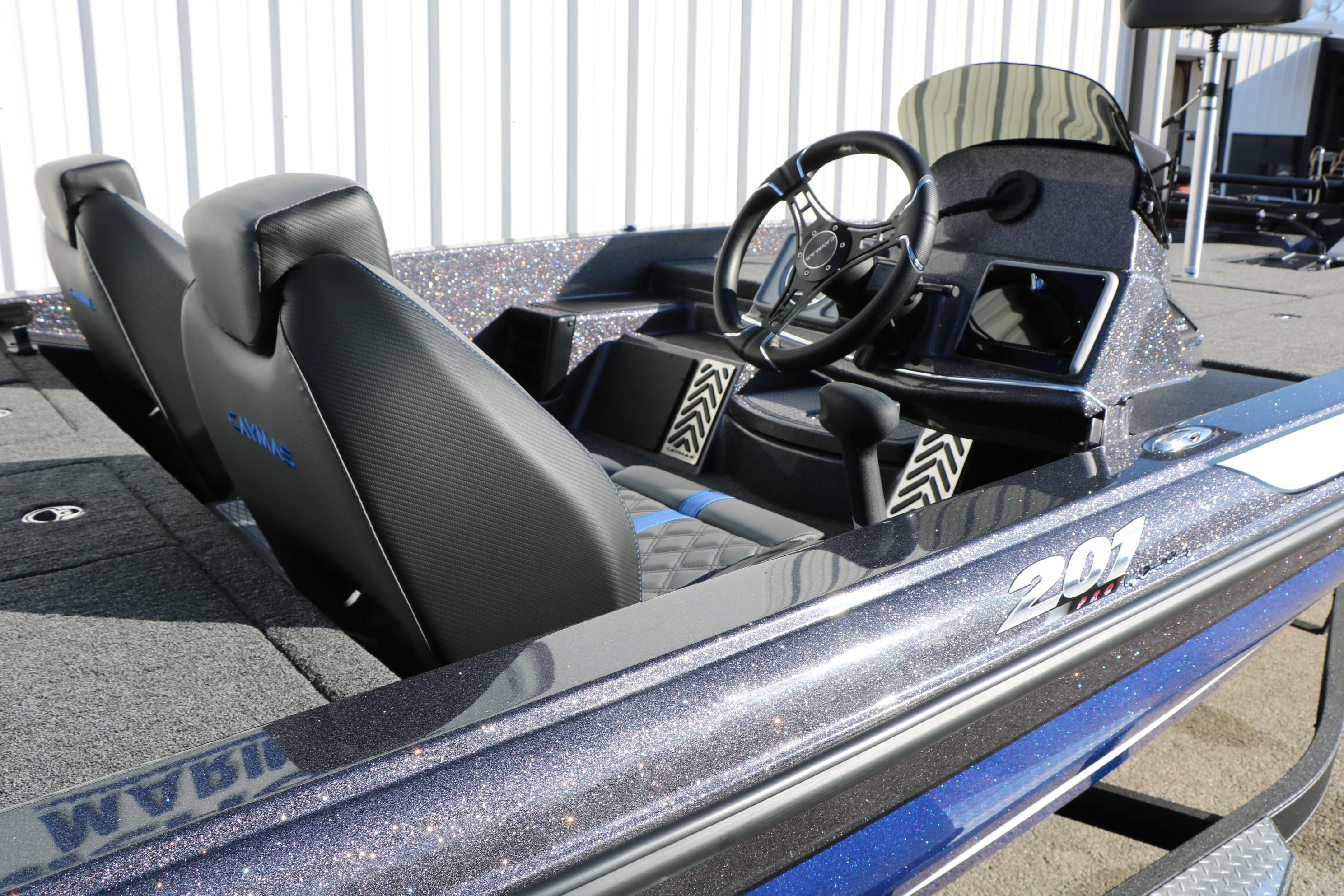 2027 Caymas 201 Pro boat interior with sleek seats and modern dashboard design.