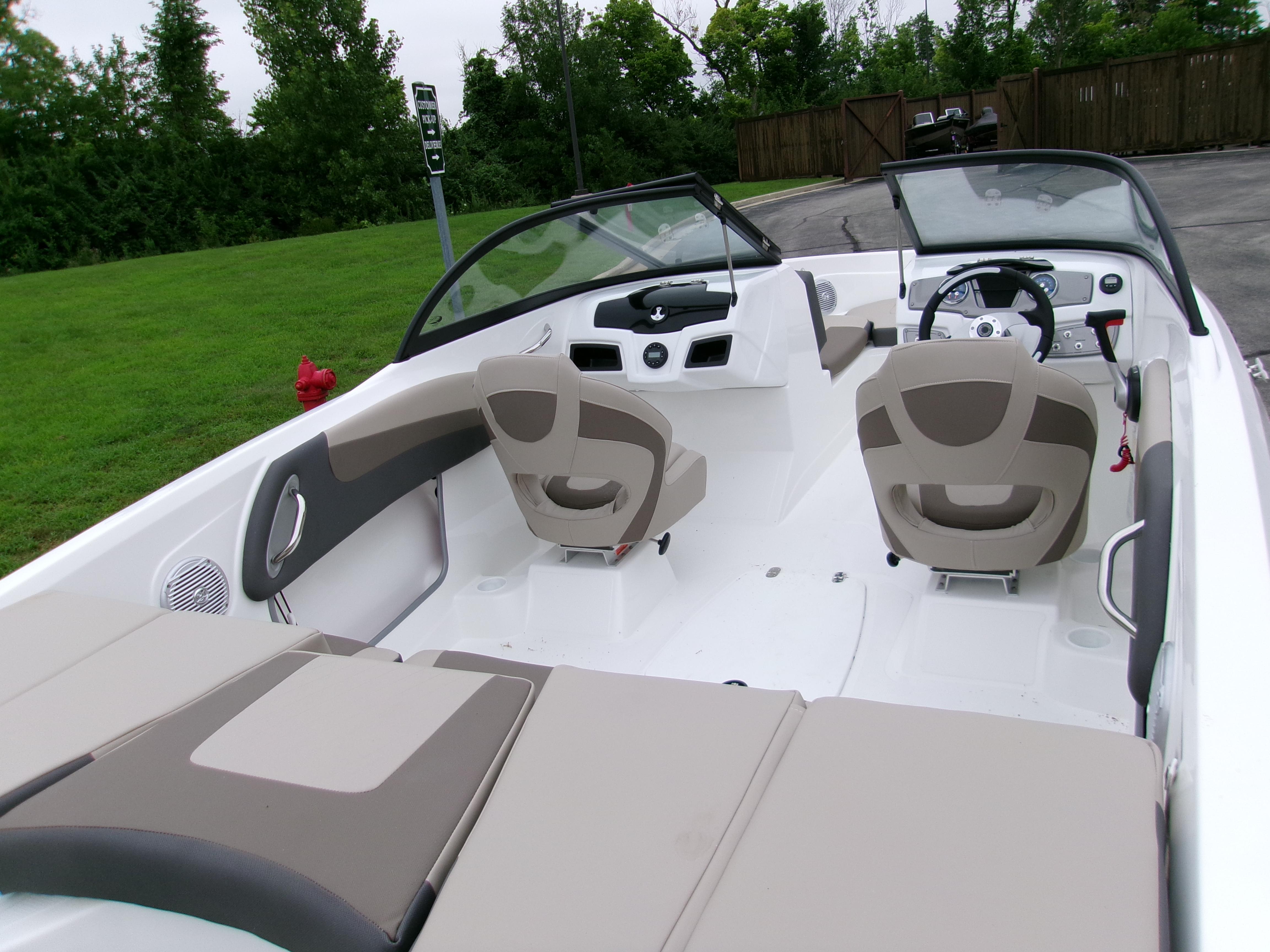 2025 Tahoe 200 S boat interior with beige seating and modern dashboard design.