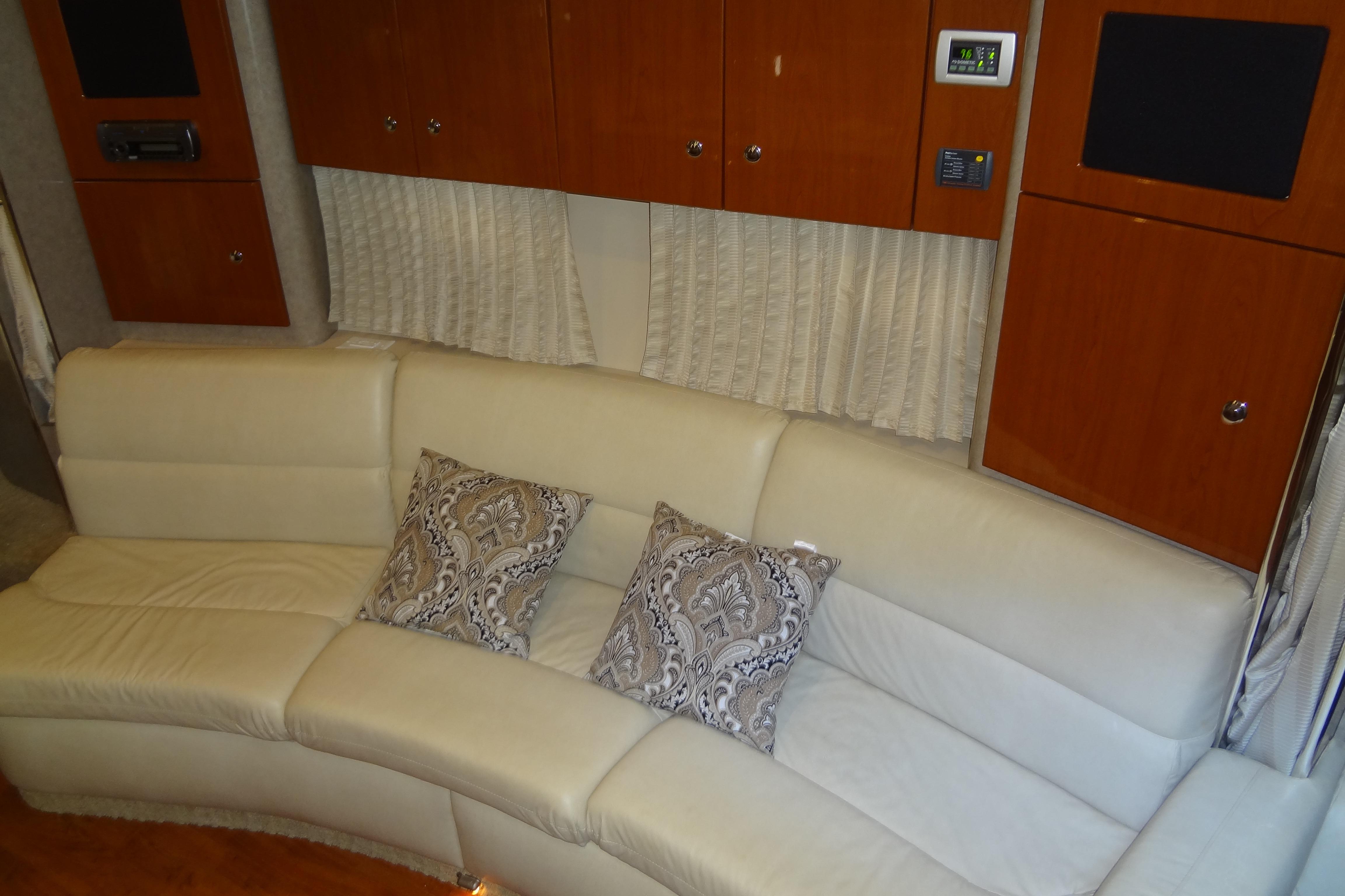 Luxurious interior of 2007 Formula 34 Performance Cruiser with cream leather seating and patterned cushions.