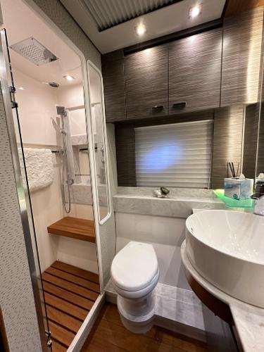 2019 Tiara Yachts C53 bathroom with modern fixtures and shower.