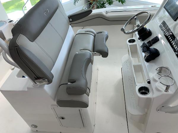 2024 Key West 263 FS boat interior with dual helm seats and steering console.
