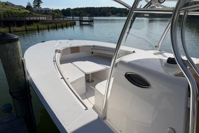 2014 Southport 29 FE boat docked by a serene waterfront.