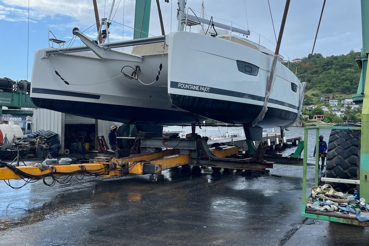 2023 Fountaine Pajot Catamaran Astrea 42 being lifted at a marina.