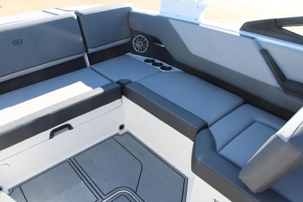 2025 Cobalt CS23 boat interior with gray seating and cup holders.