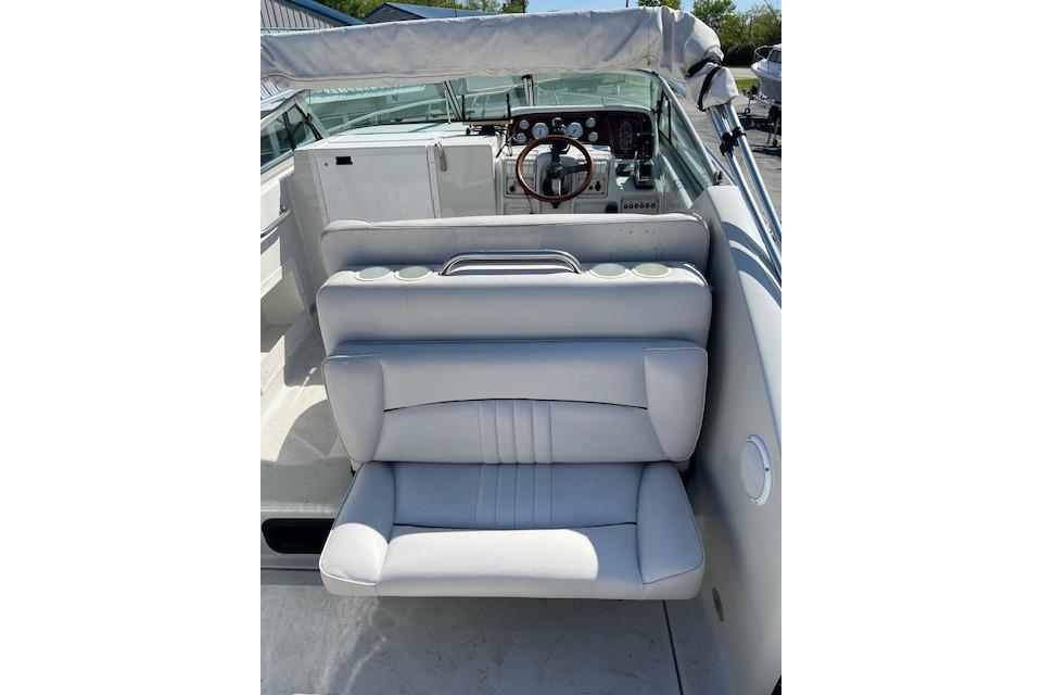 1997 Crownline 250 CR boat interior with white seating and dashboard view.