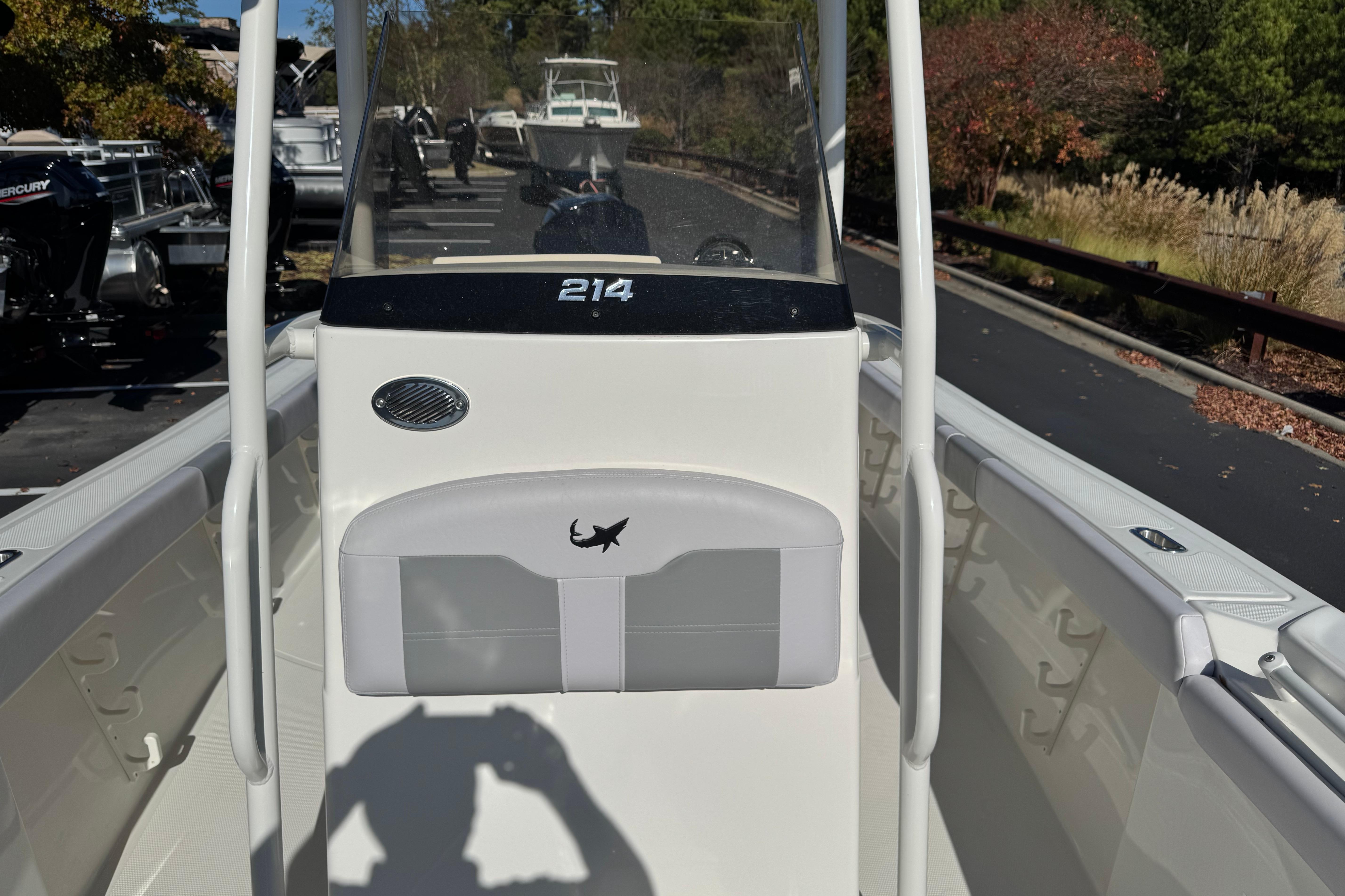 2026 Mako 214 Center Console boat, white interior, outdoor display setting.