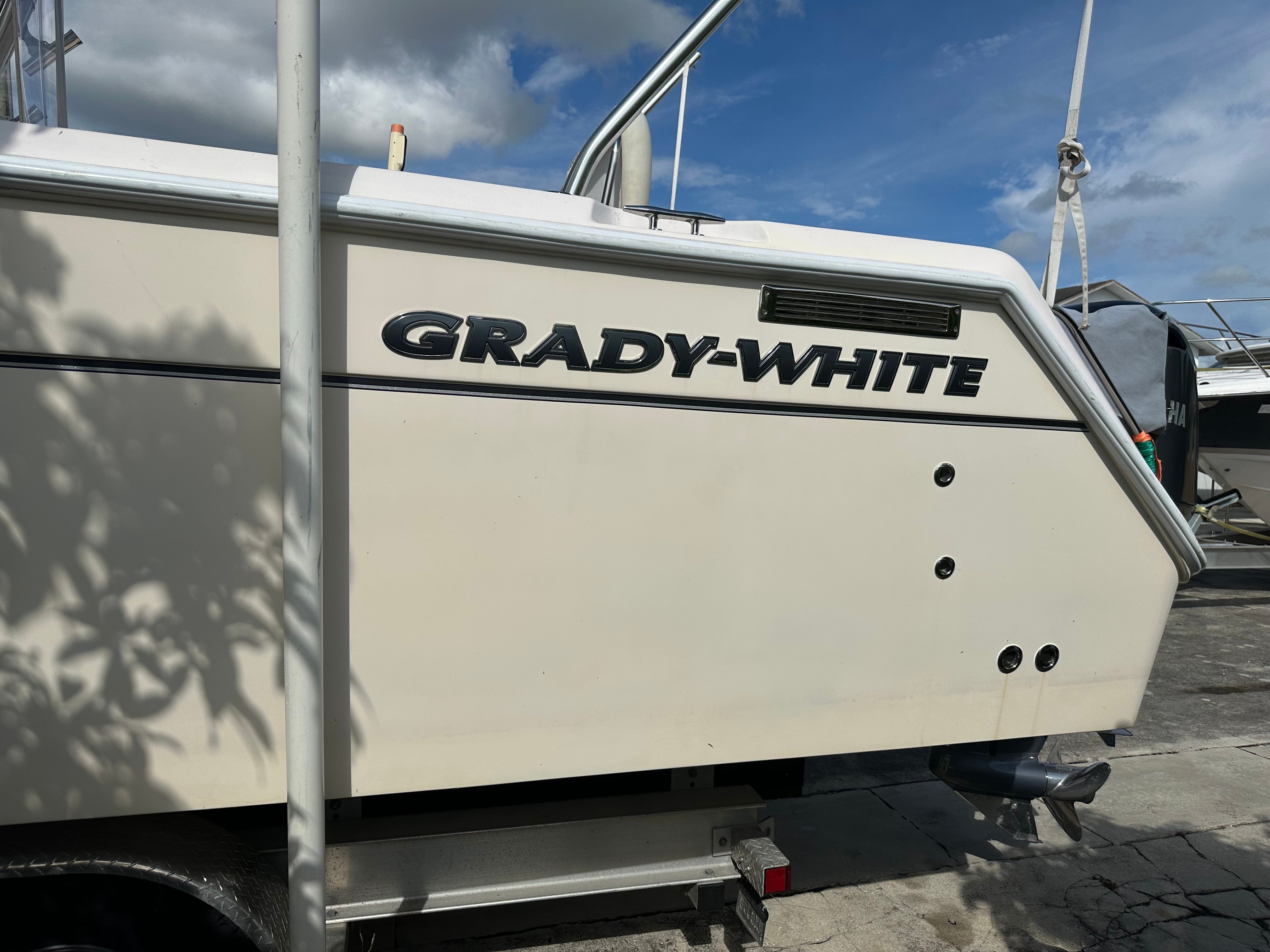 Side view of a 2003 Grady-White Express 330 on a trailer.