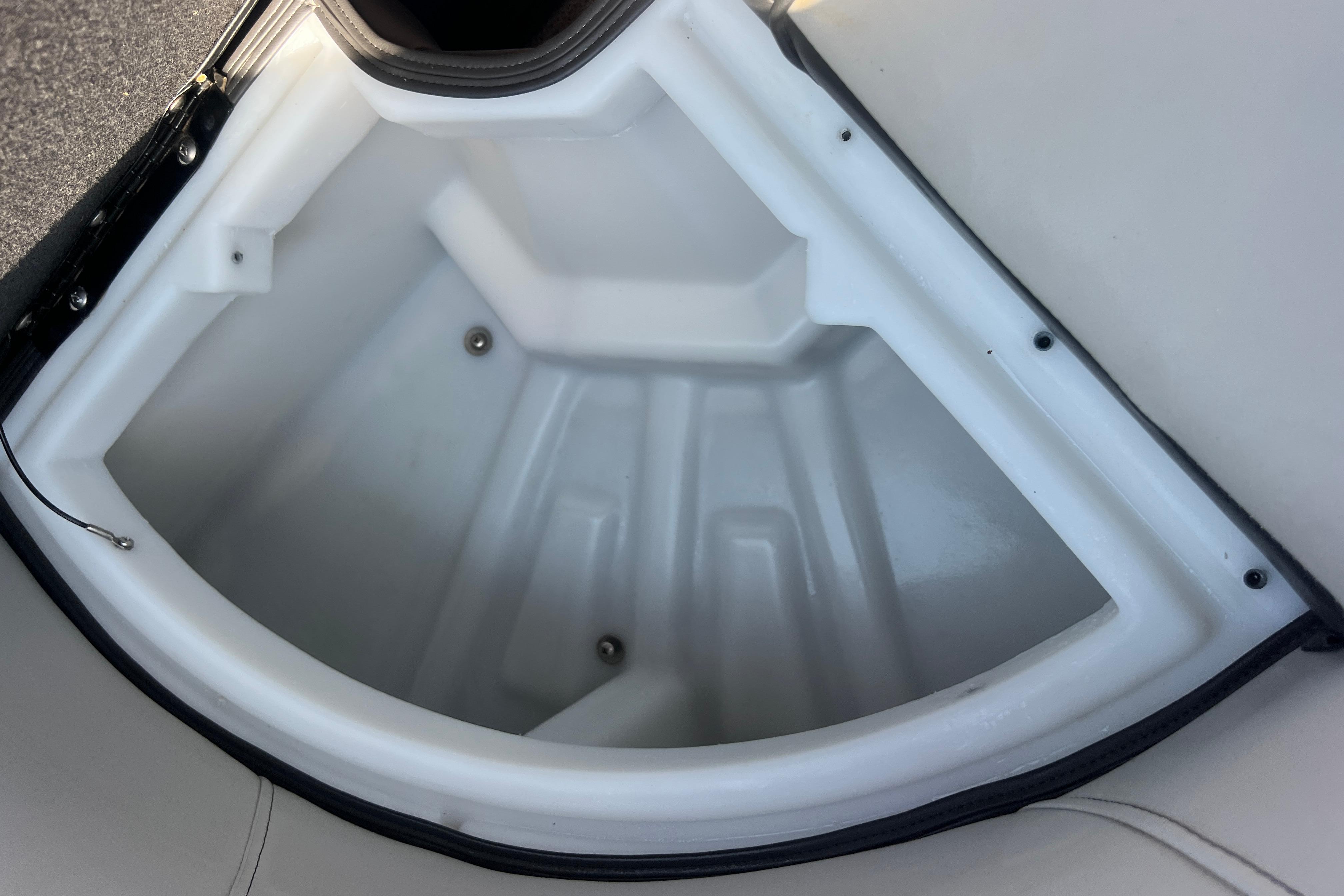 Storage compartment of 2022 Viaggio Lago V-U 22 boat, featuring a white interior.