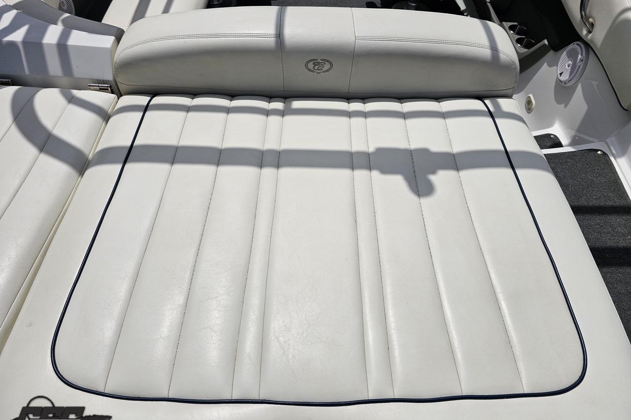 White leather seating on a 2010 Cobalt 232 WSS boat, featuring sleek stitching.