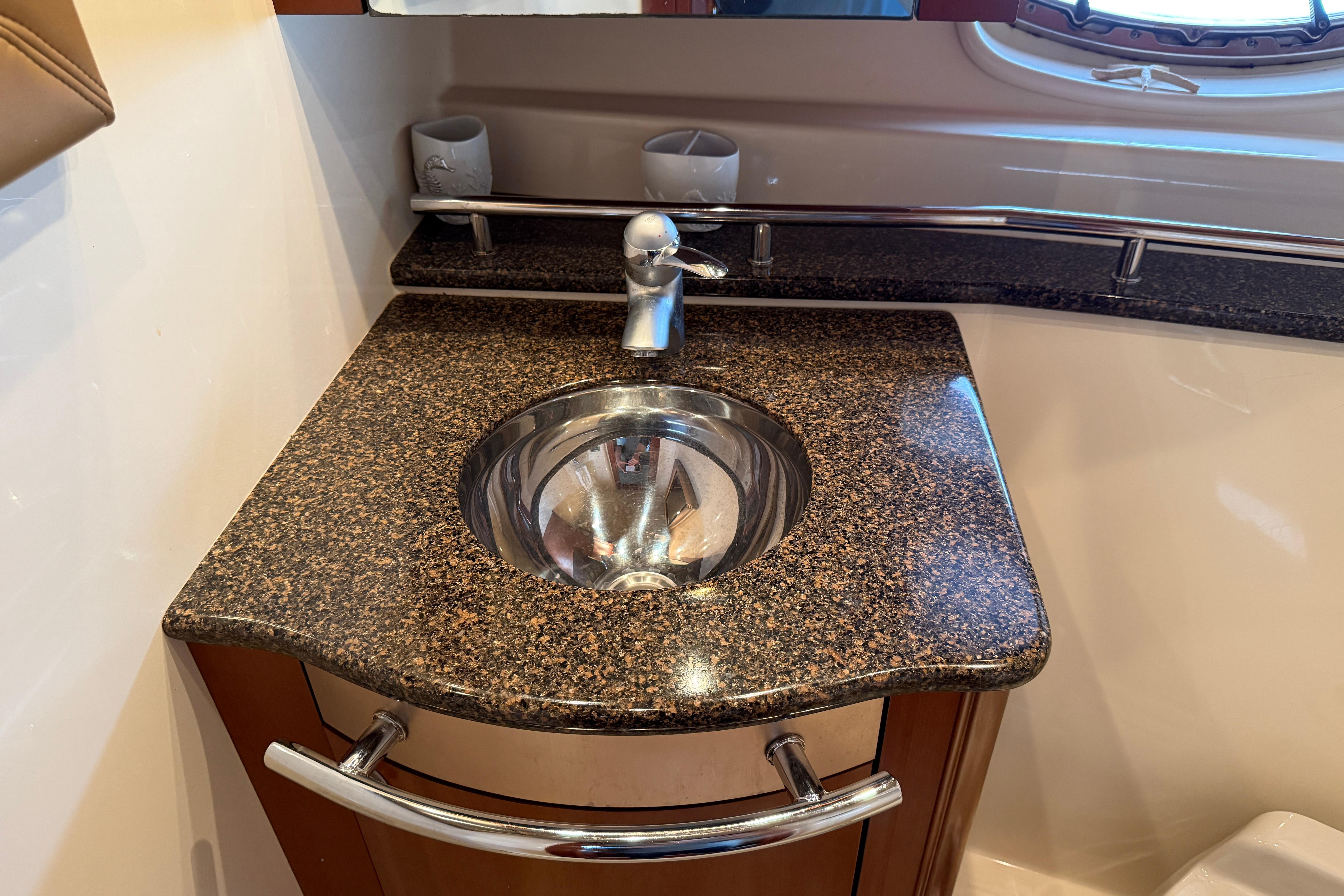 Luxury bathroom sink in 2006 Sea Ray 48 Sundancer yacht with granite countertop.